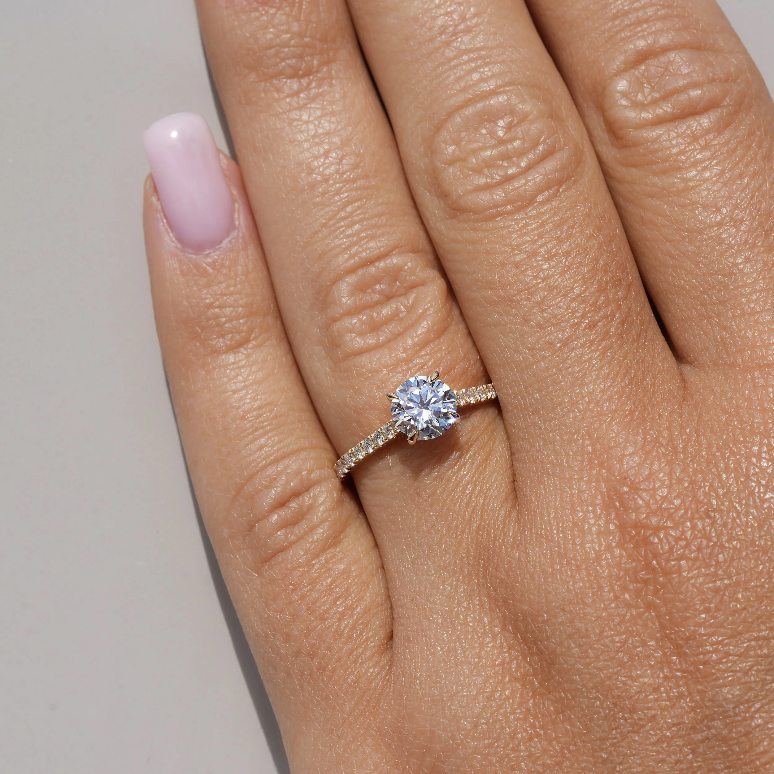 1ct Round Brilliant Cut Diamond Engagement Ring with Diamond Band in 18ct Yellow Gold –Hand View | Eighty8Diamonds