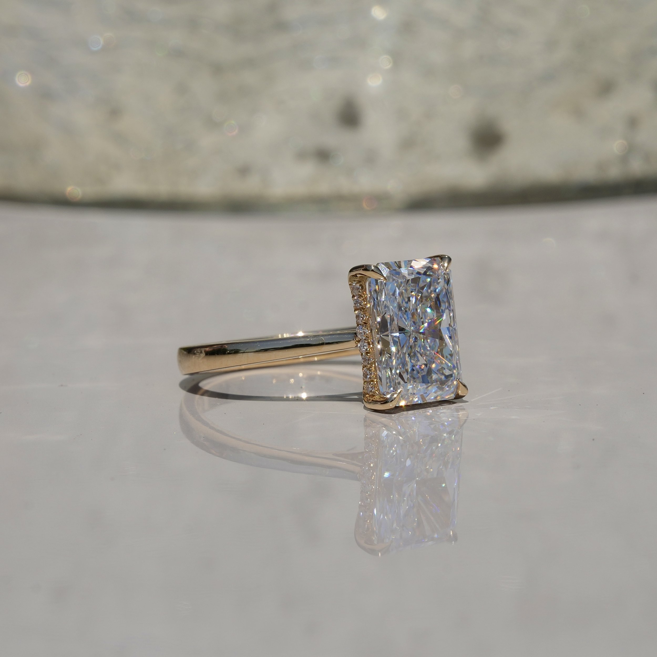 3ct Radiant Cut Diamond Solitaire Engagement Ring with Hidden Halo  in 18ct Yellow Gold – Angeled View | Eighty8Diamonds