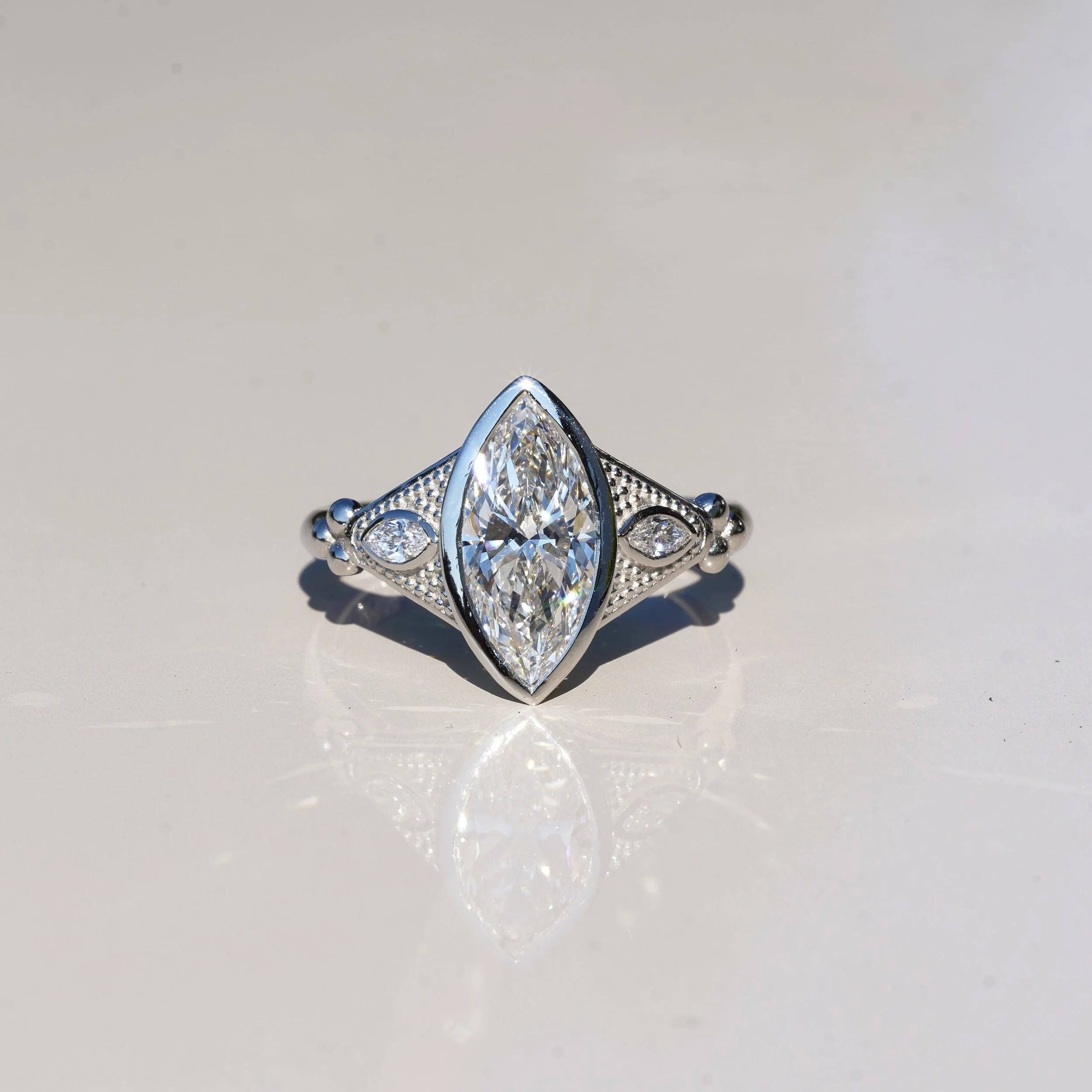 Marquise Bezel Set Diamond Ring with Milgrain in Platinum