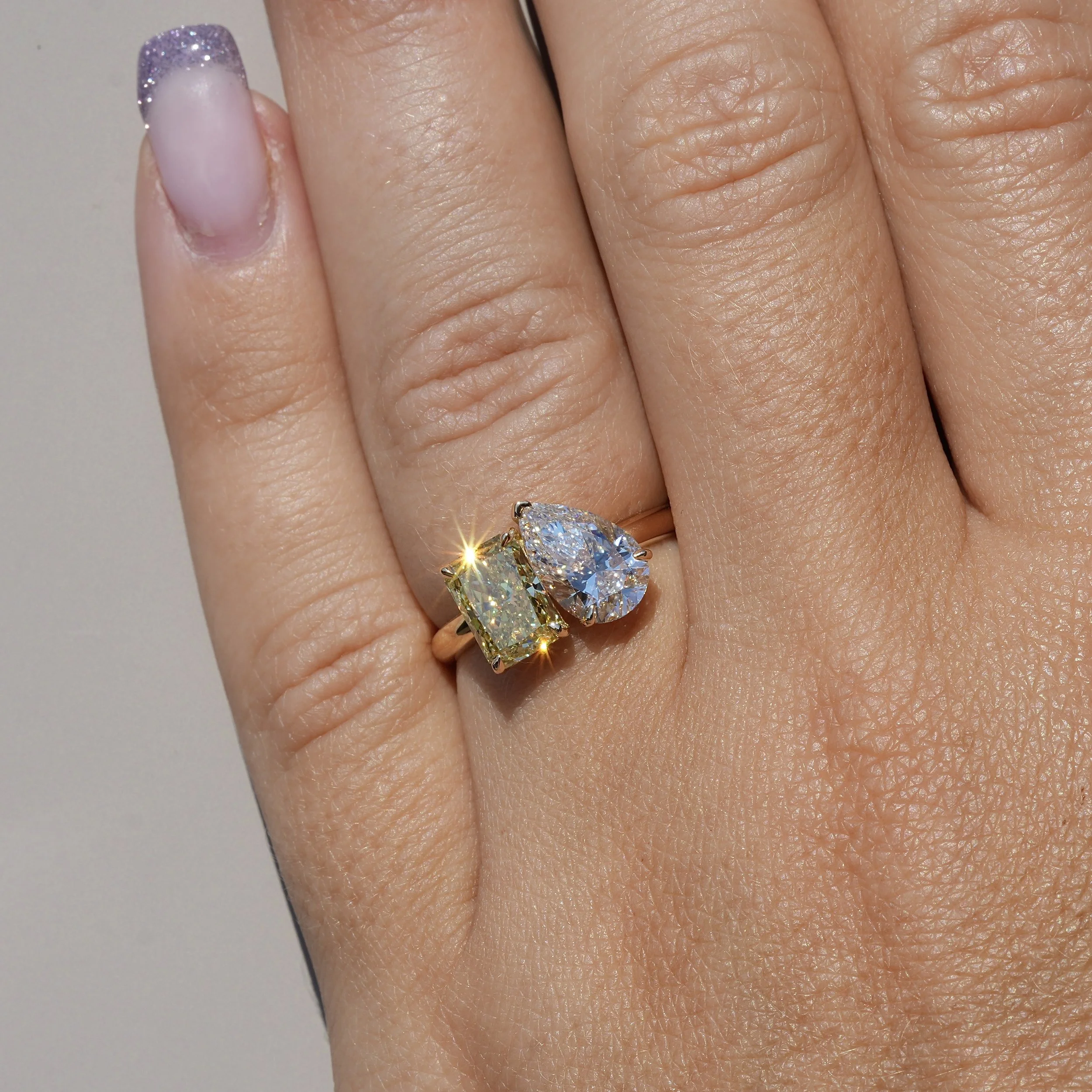 Toi et Moi Ring with 1.5ct Fancy Intense Yellow Radiant Cut Diamond and 1.5ct Pear Cut Diamond in 18ct Yellow Gold, Total Carat Weight 3ct – Angeled View | Eighty8Diamonds