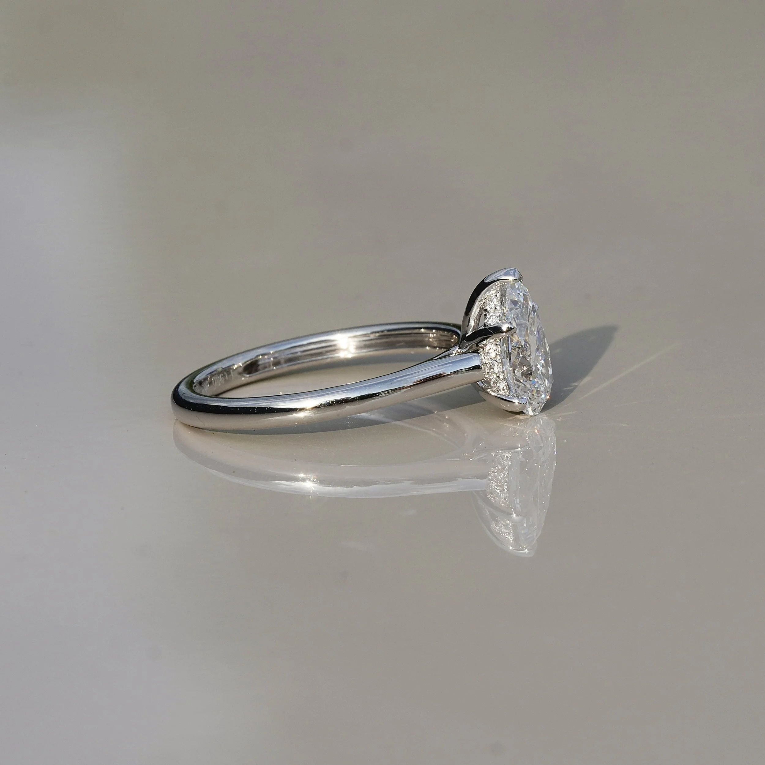 1ct Pear Cut Diamond Hidden Halo Ring in Platinum – IGI Certified – Side View | Eighty8Diamonds