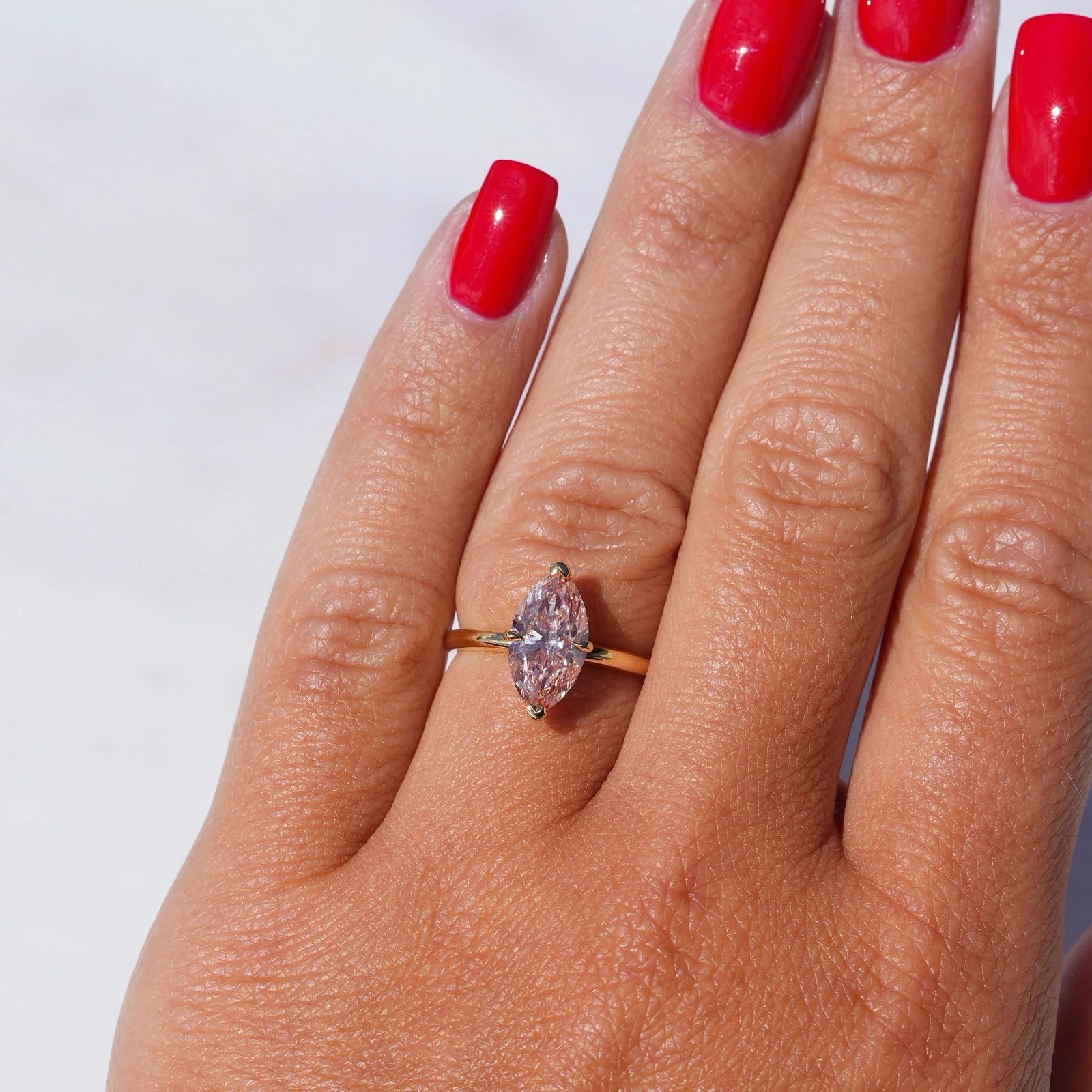 marquise-pink-diamond-2carat-solitaire-18ct-yellow-gold-eighty8diamonds-hand-view