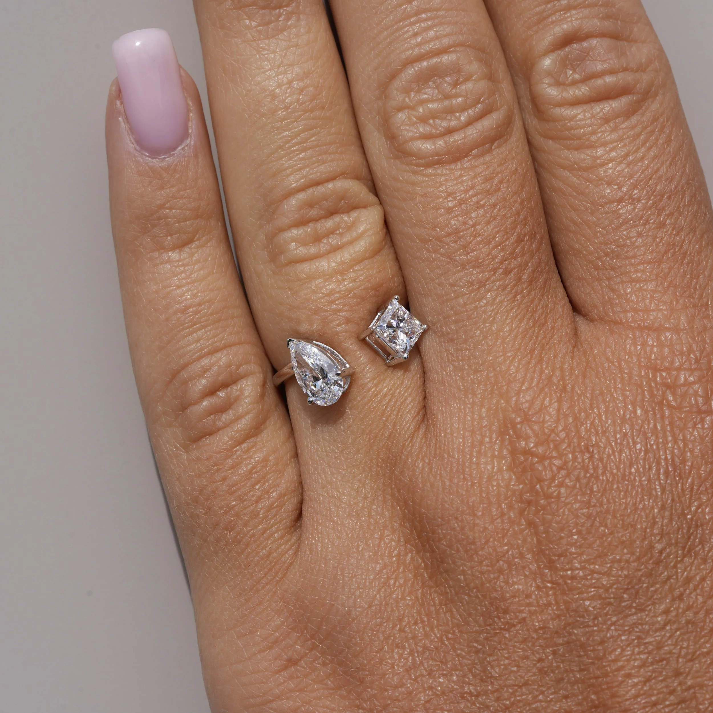 Toi et Moi Ring with 0.80ct Princess Cut Diamond and 0.80ct Pear Cut Diamond in 18ct White Gold, Total Carat Weight 1.60ct – Hand View | Eighty8Diamonds