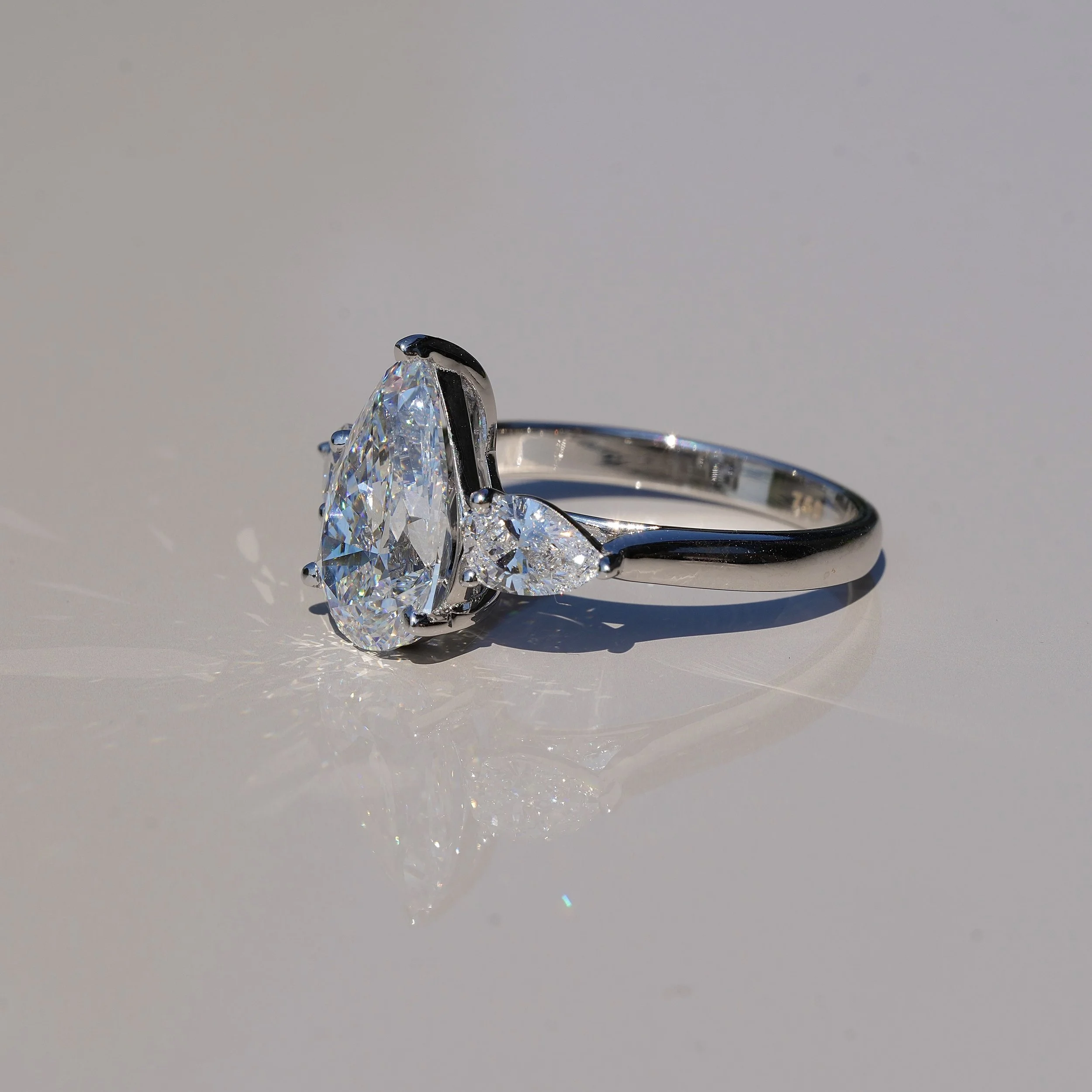 3ct Pear Cut Diamond Trilogy Engagement Ring with Two 0.4ct Side Stones in 18ct White Gold, Total 3.8ct – Box View | Eighty8Diamonds