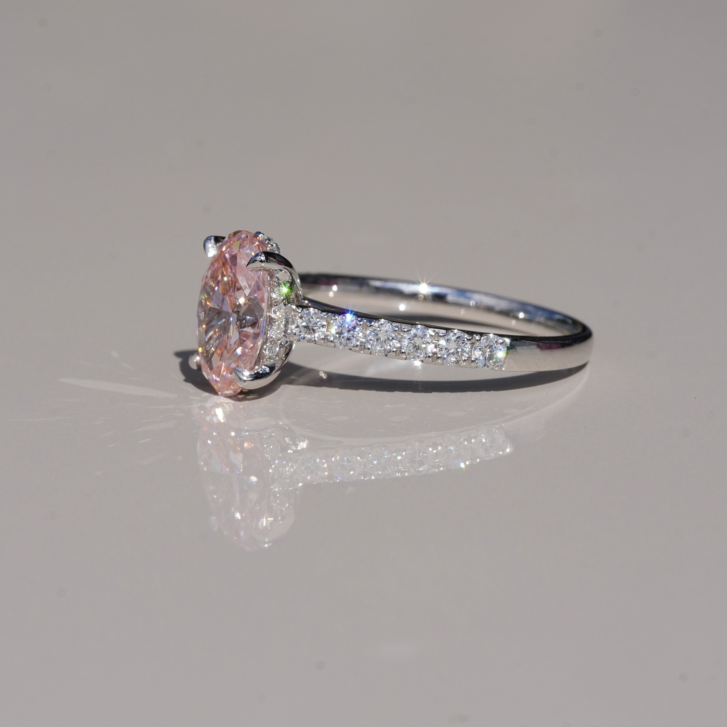 2ct Fancy Vivid Pink Oval Cut Diamond Engagement Ring with Diamond Band in Platinum –Side View | Eighty8Diamonds
