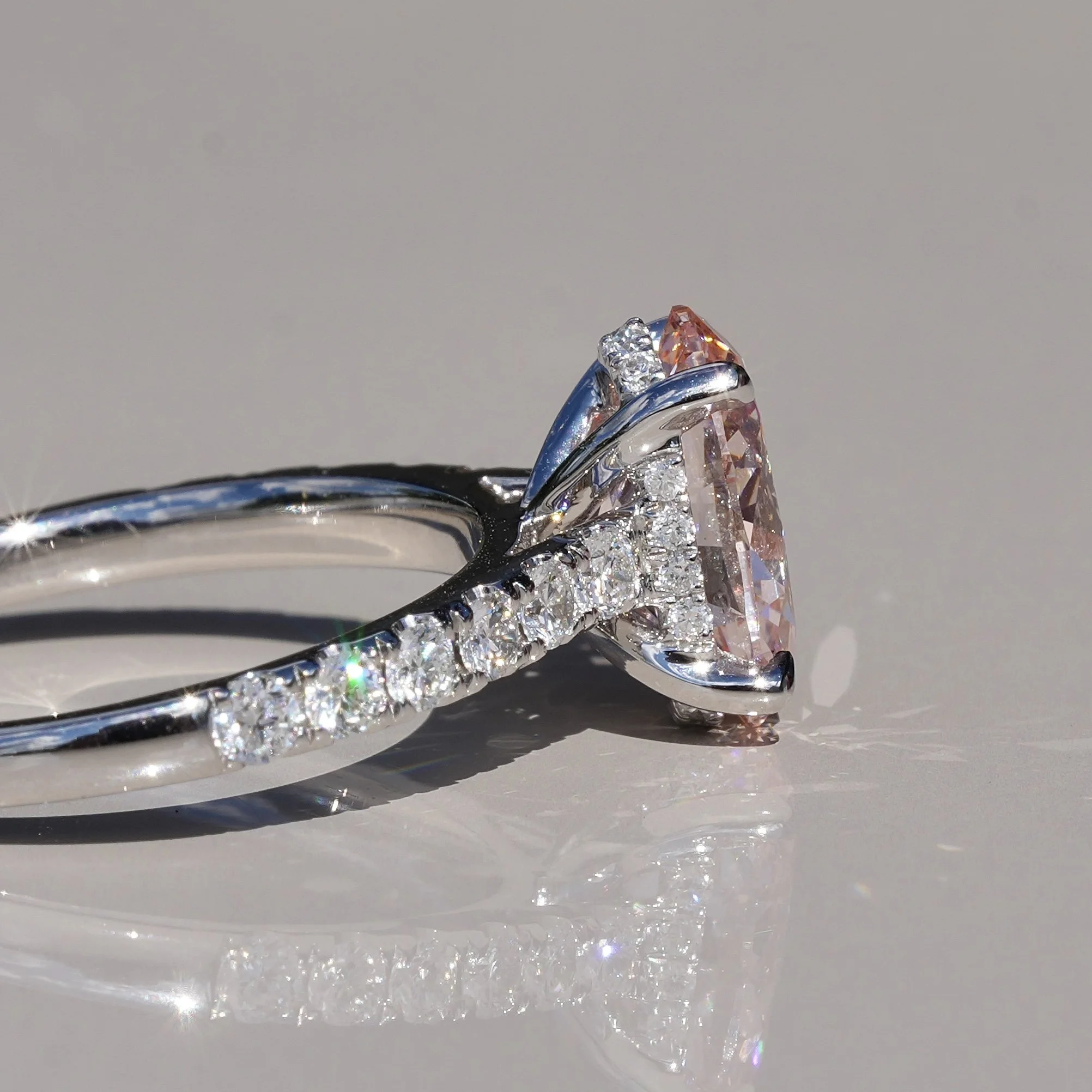 2ct Fancy Vivid Pink Oval Cut Diamond Engagement Ring with Diamond Band in Platinum –Angeled View | Eighty8Diamonds