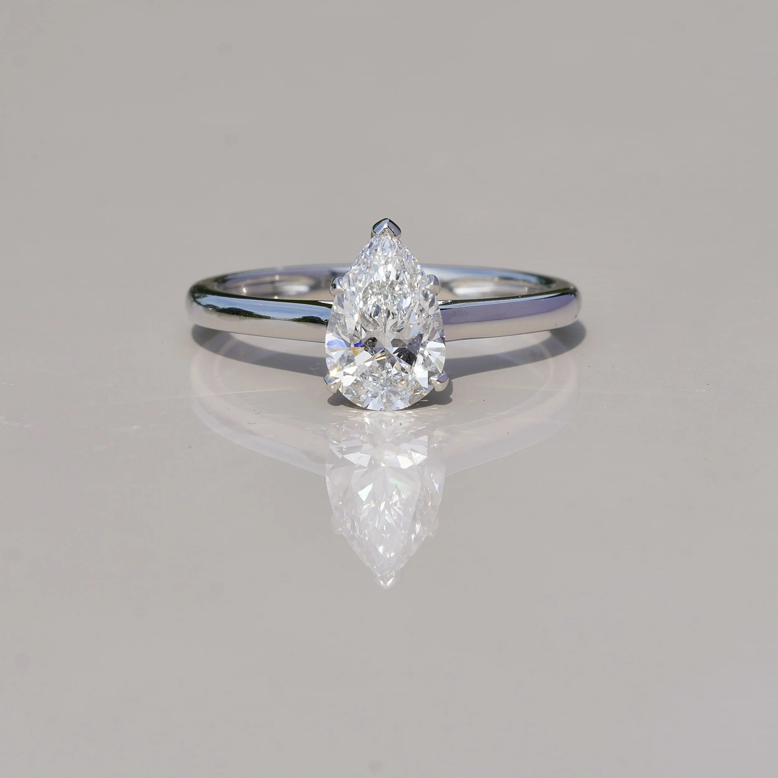 1ct Pear Cut Diamond Hidden Halo Ring in Platinum – IGI Certified – Front View | Eighty8Diamonds