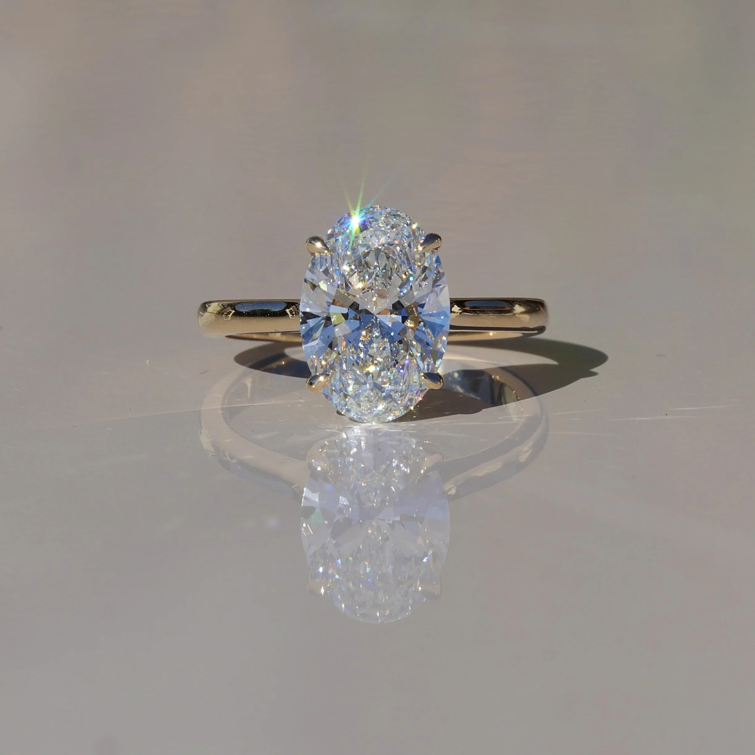 3ct Oval Cut Diamond Engagement Ring With Hidden Halo in 18ct Yellow Gold - Front View |