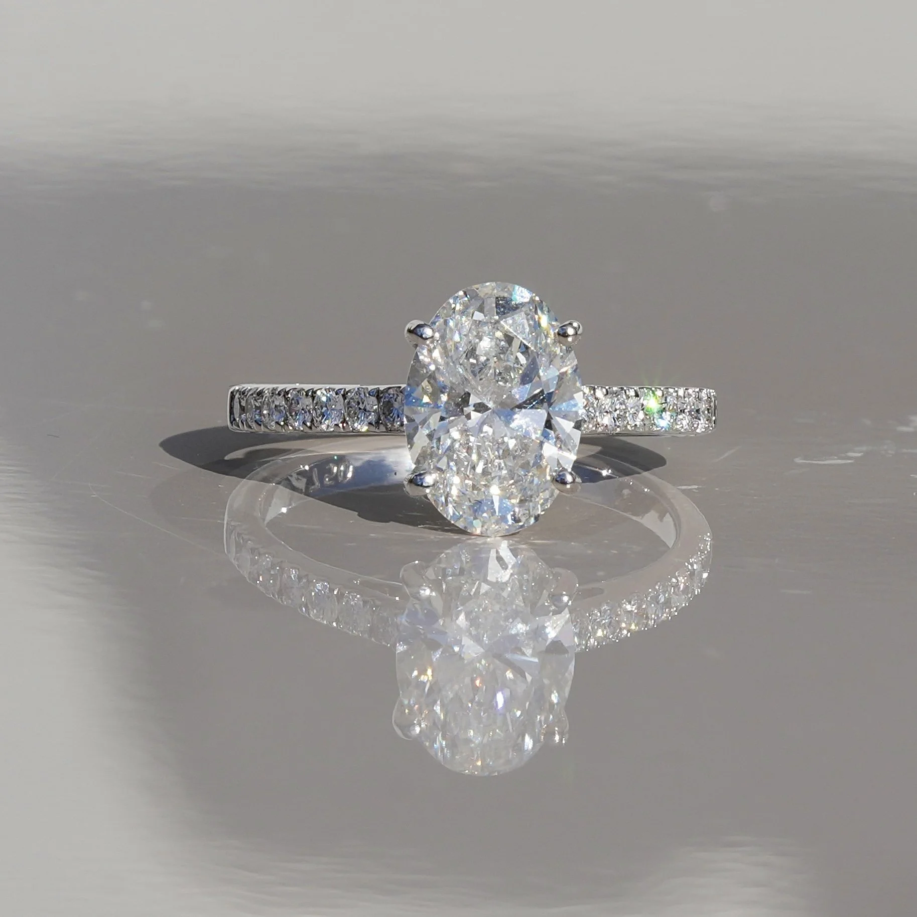 2ct Oval Cut Diamond Engagement Ring with Diamond Band in 18ct White Gold – Side View | Eighty8Diamonds