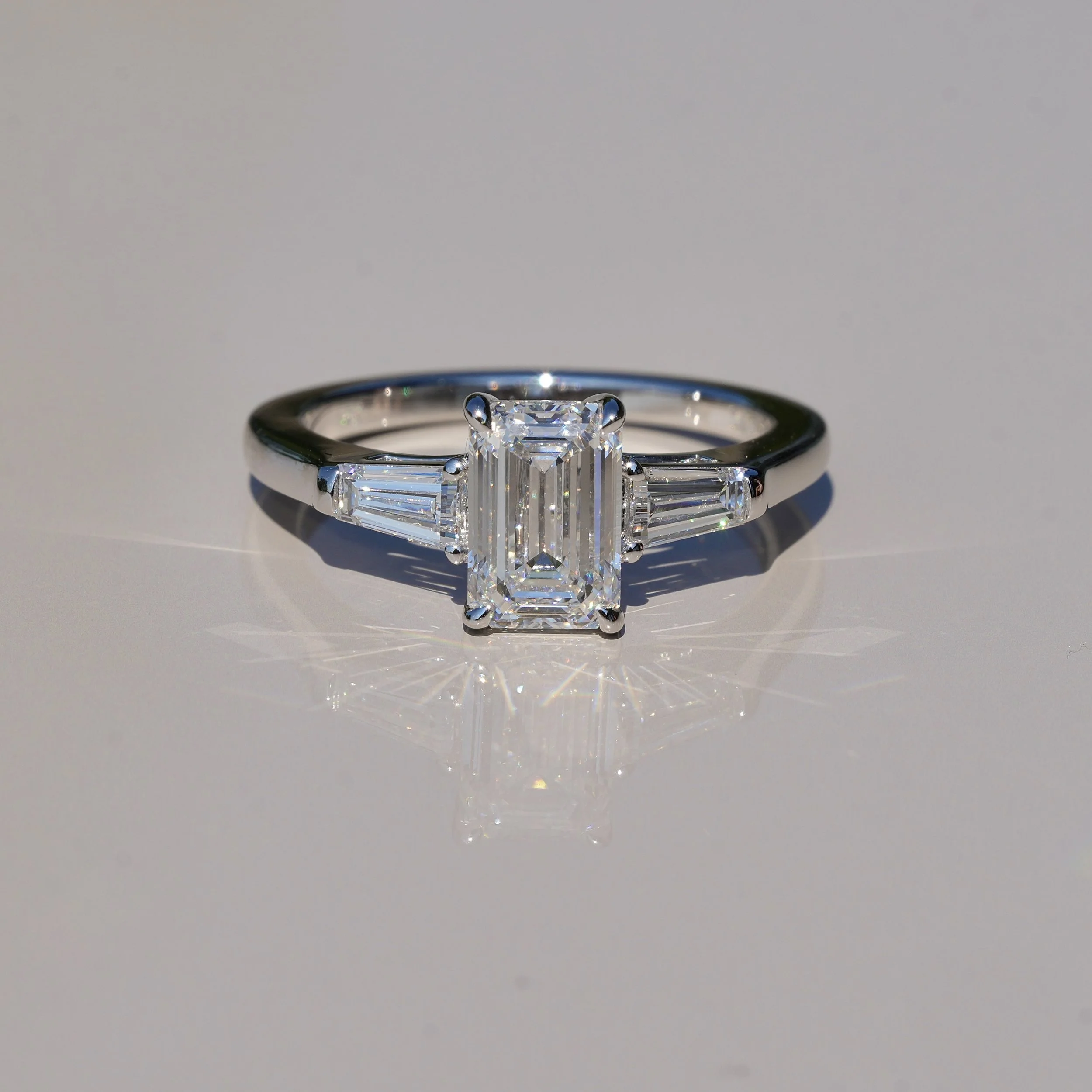 Emerald Cut Trilogy Ring with 1.5ct Centre Stone and Two 0.25ct Baguette Side Stones in 14ct White Gold, Total Carat Weight 2ct – Side View | Eighty8Diamonds