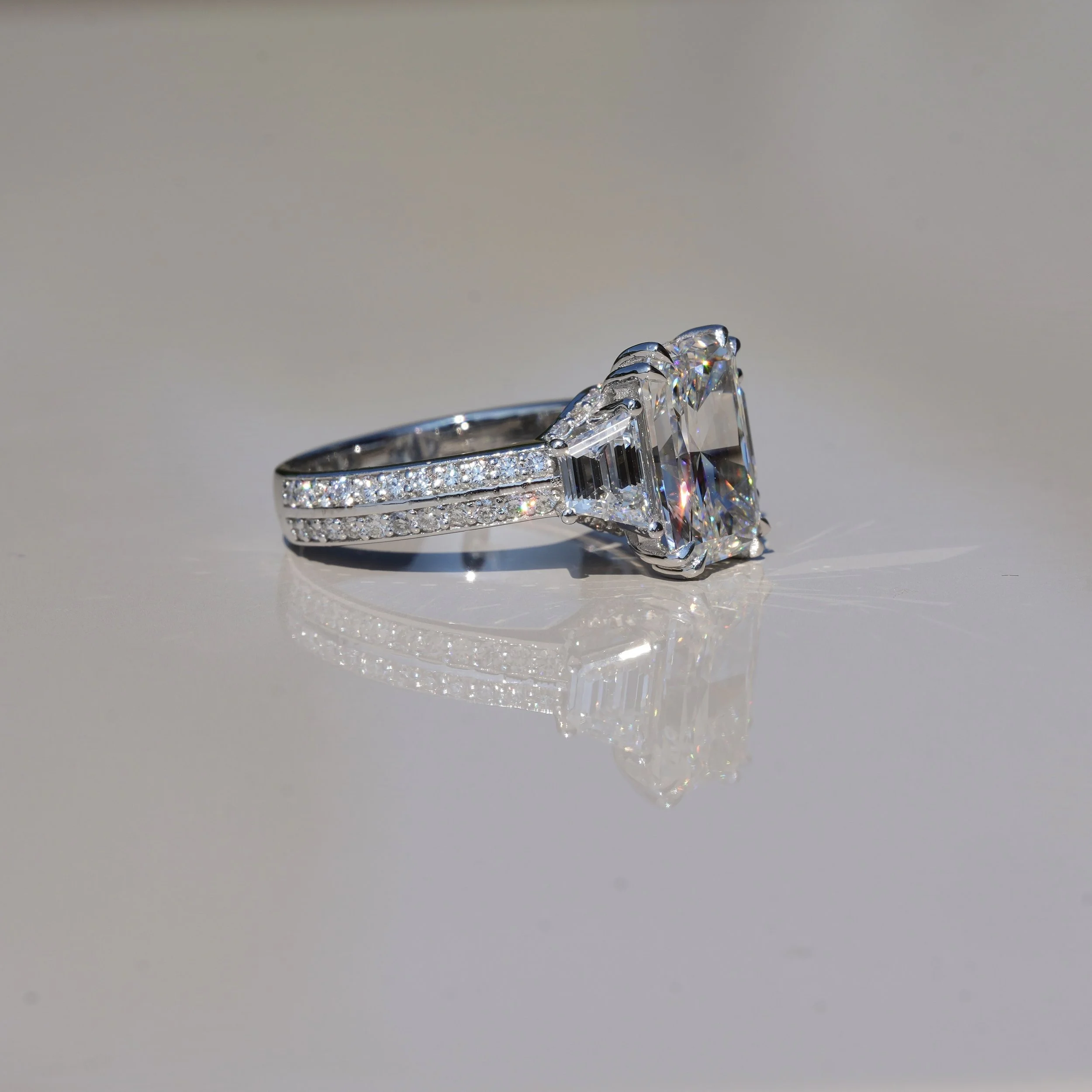 4ct Radiant Cut Diamond Engagement Ring with 3D Diamond Band and Trapezoid Side Stones in 18ct White Gold – Side View | Eighty8Diamonds
