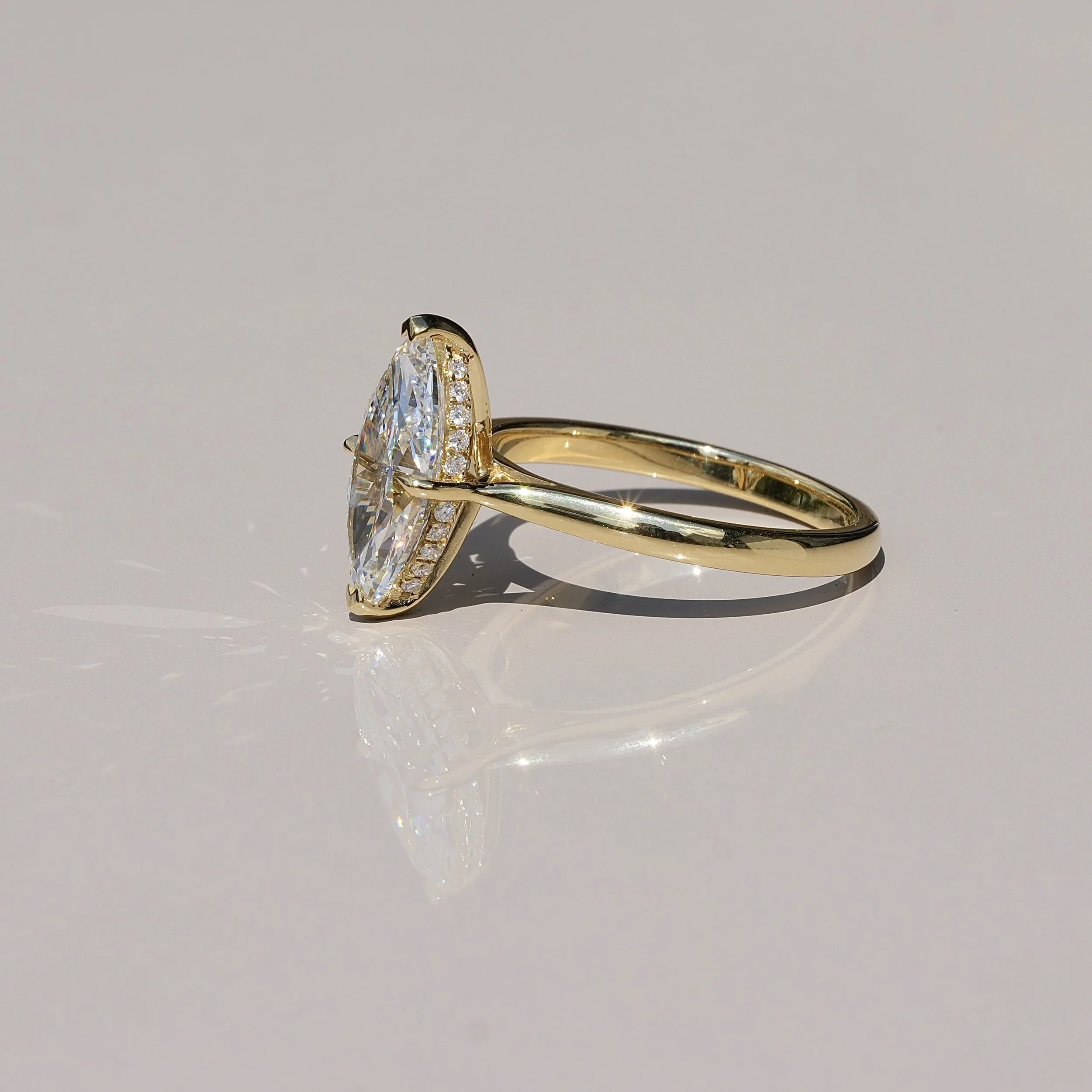 3ct Marquise Cut Diamond Solitaire Engagement Ring with Hidden Halo  in 18ct Yellow Gold – Angeled View | Eighty8Diamonds