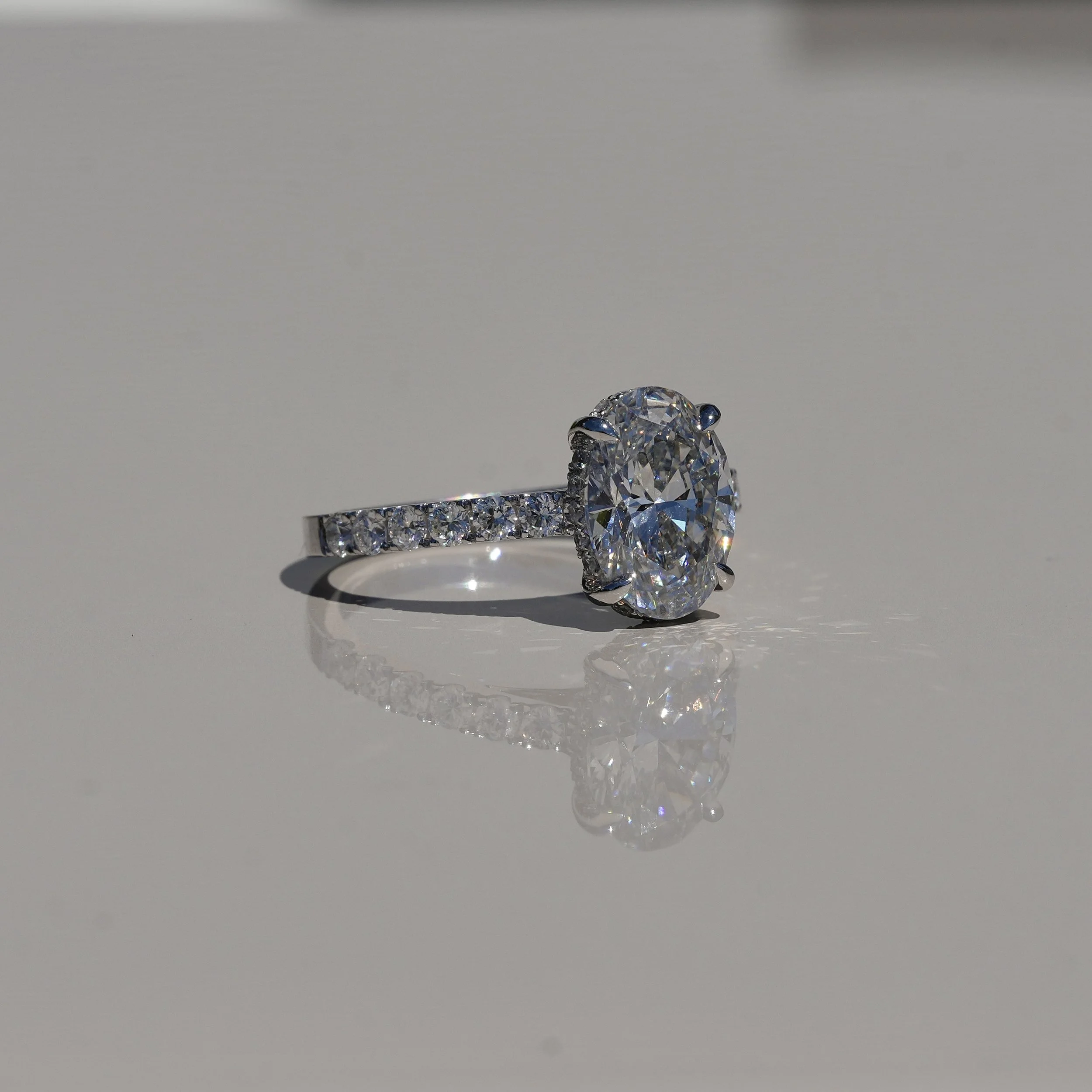 2ct Oval Cut Diamond Engagement Ring with Diamond Band in Platinum –Side View | Eighty8Diamonds
