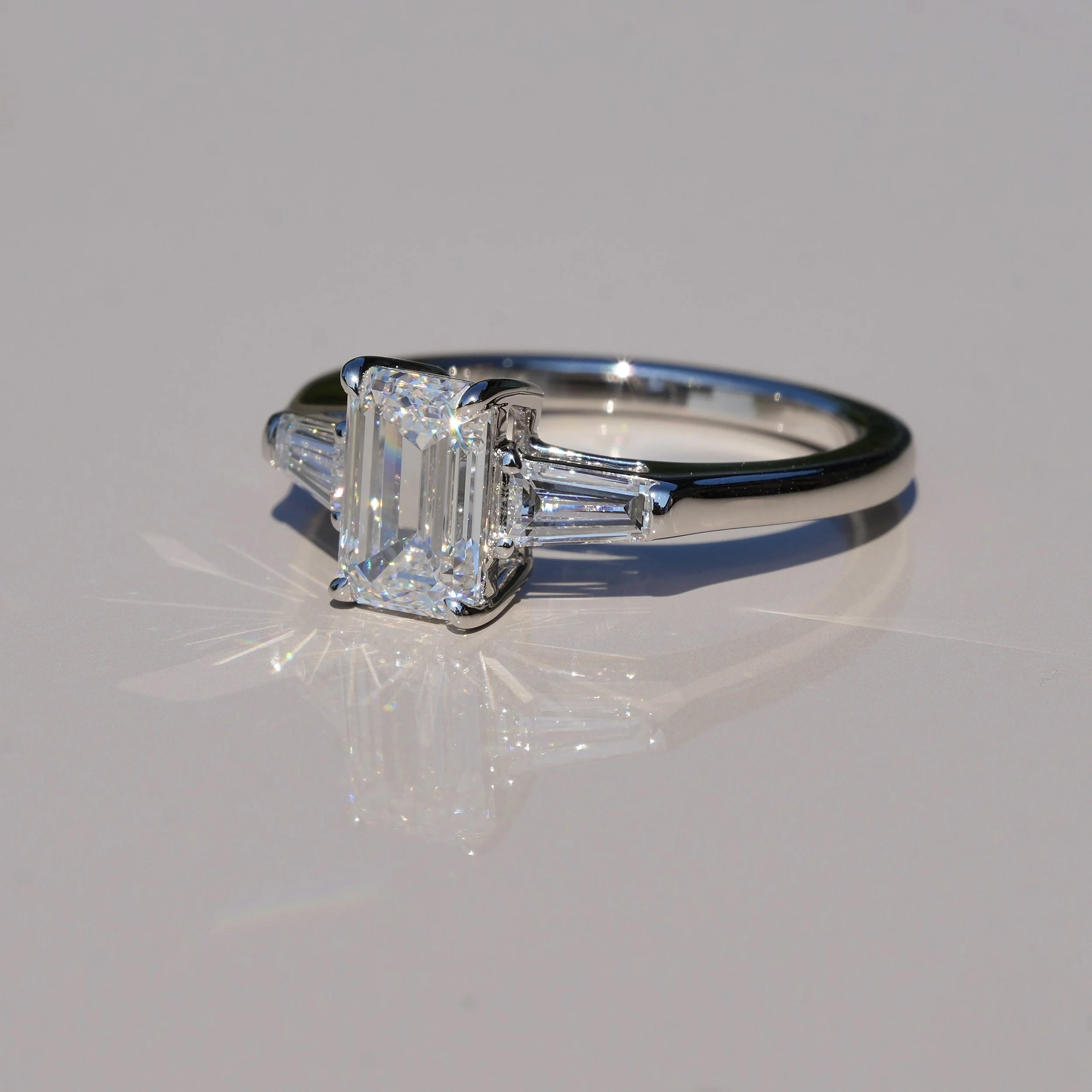 Emerald Cut Trilogy Ring with 1.5ct Centre Stone and Two 0.25ct Baguette Side Stones in 14ct White Gold, Total Carat Weight 2ct – Back View | Eighty8Diamonds