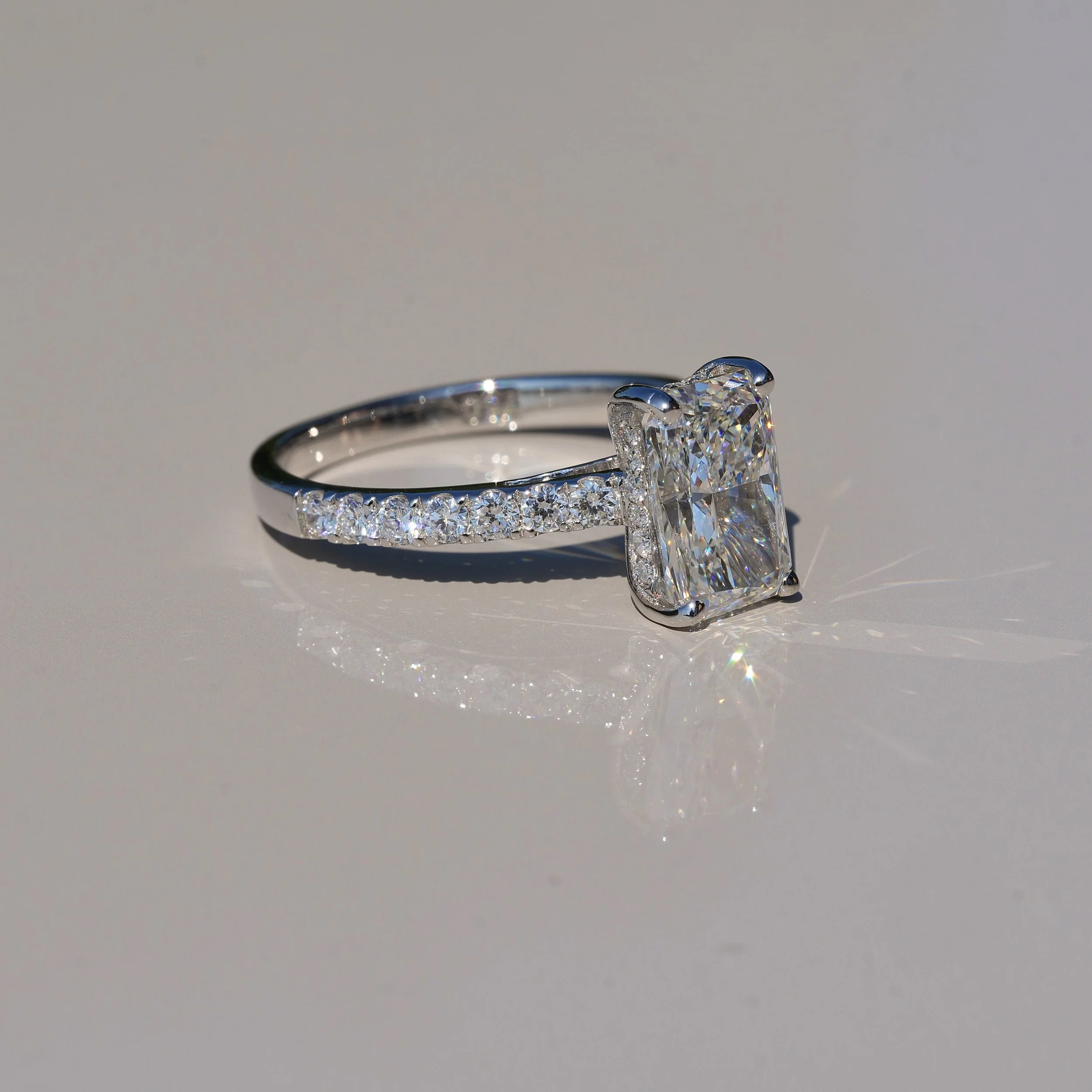 2ct Radiant Cut Diamond Engagement Ring with Diamond Band in 18ct White Gold, Total Carat Weight 2.5ct –Angeled View | Eighty8Diamonds