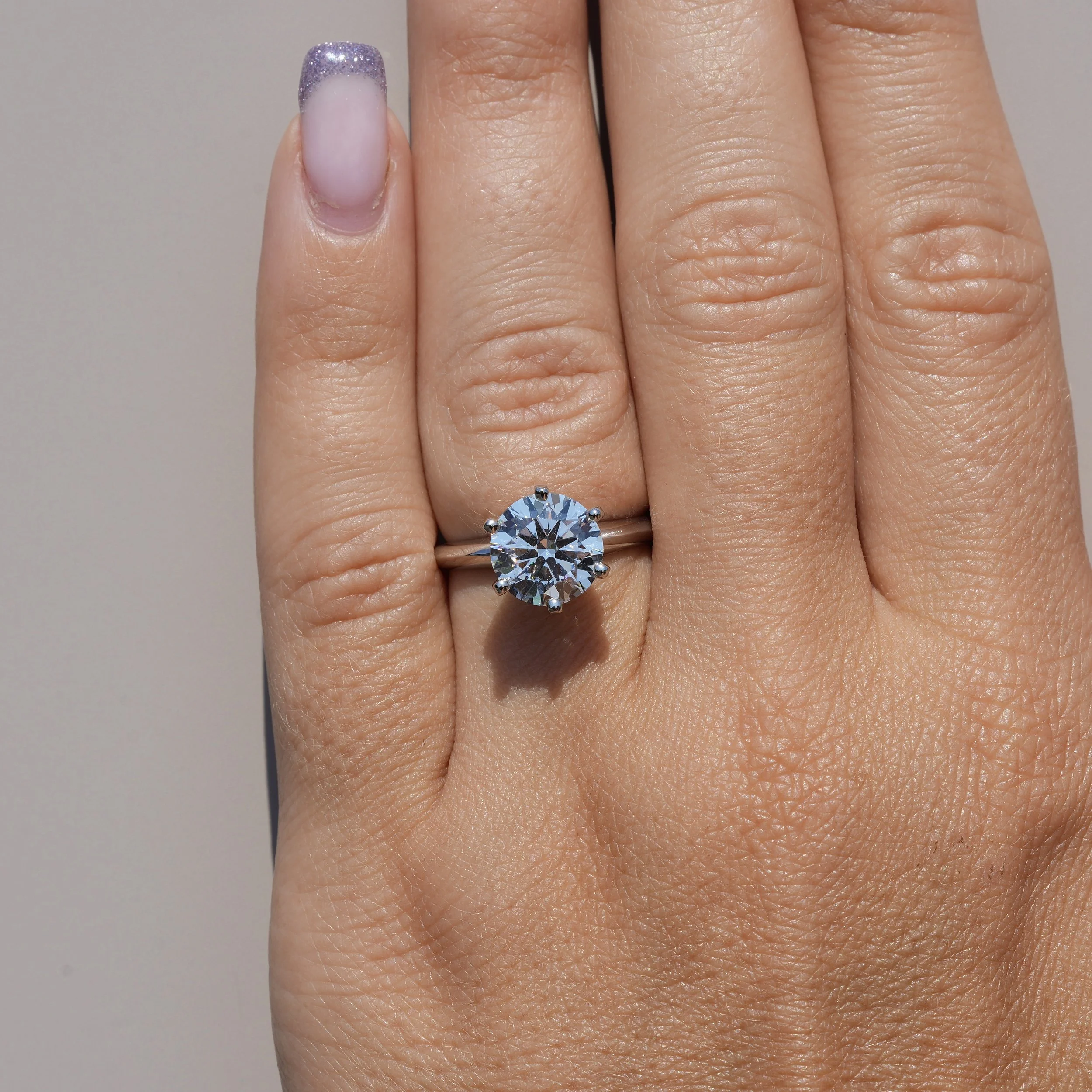 Tiffany Desing Diamond Solitaire Engagement Ring  in Platinum –Hand View | Eighty8Diamonds