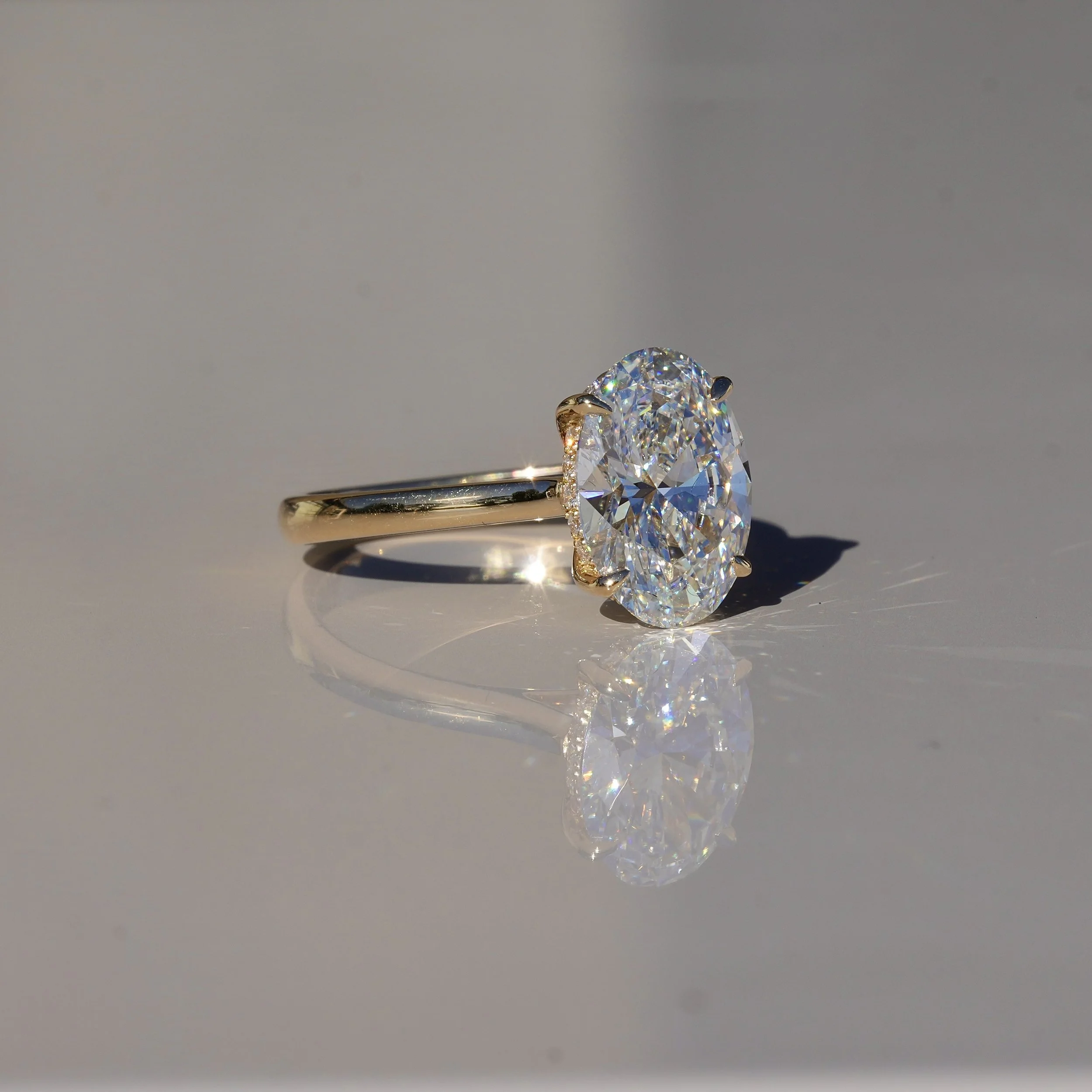 3ct Oval Cut Diamond Engagement Ring With Hidden Halo in 18ct Yellow Gold - Back View |