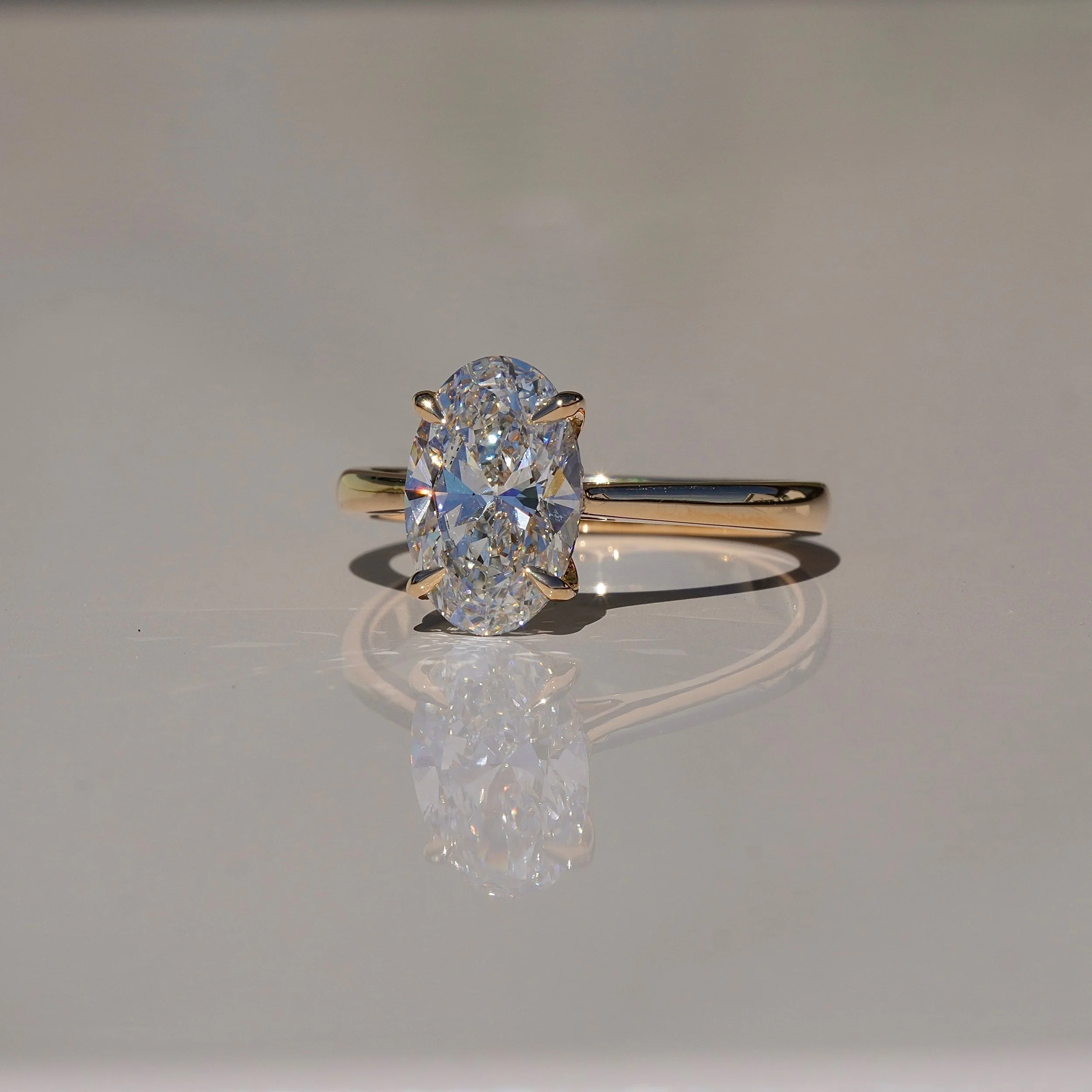 2ct Oval Cut Diamond Engagement Ring With Hidden Halo in 18ct Yellow Gold - Side View |
