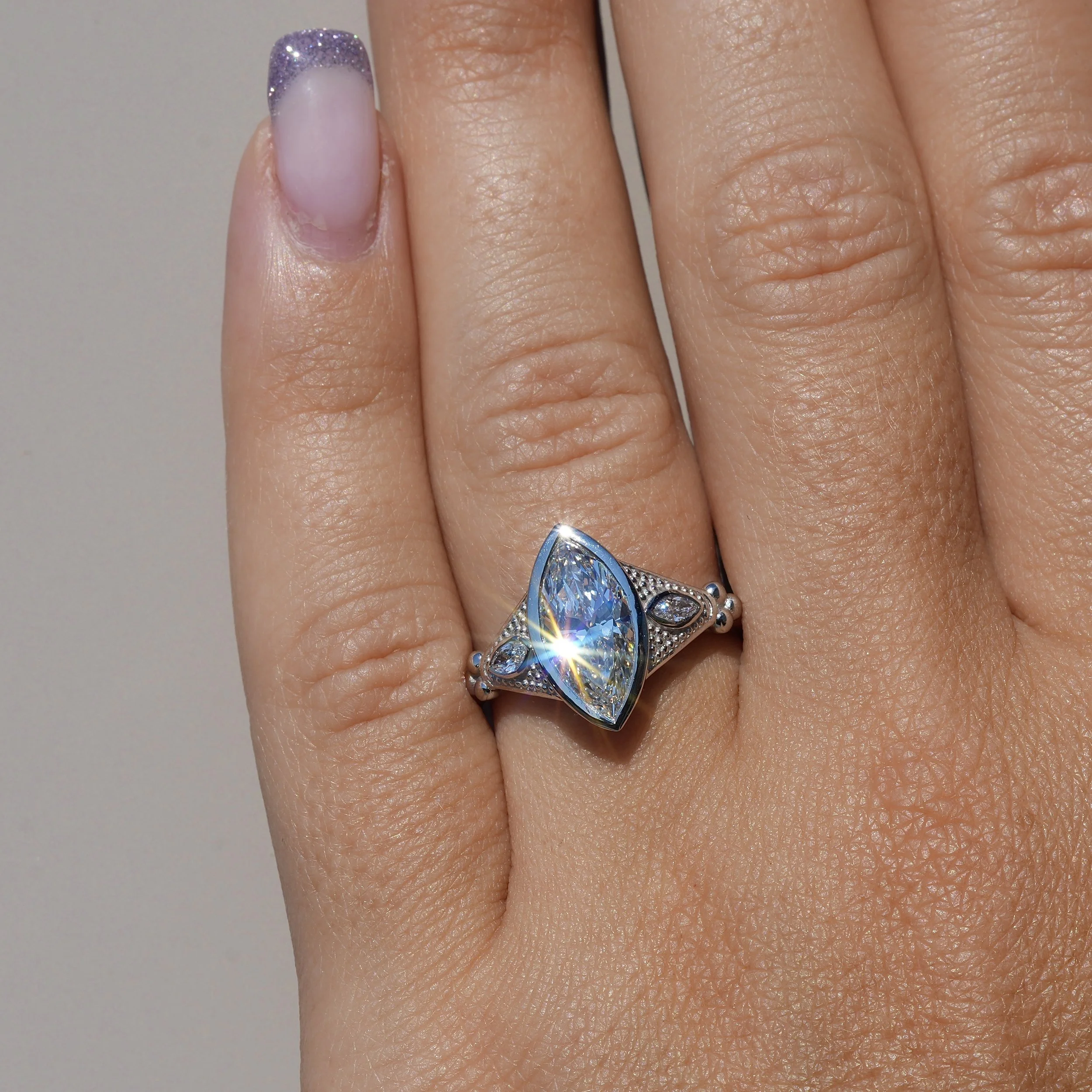 2ct Marquise Bezel Set Diamond Ring with Milgrain with two 0.1ct Side Stones in Platinum, Total 2.2ct – Box View | Eighty8Diamonds