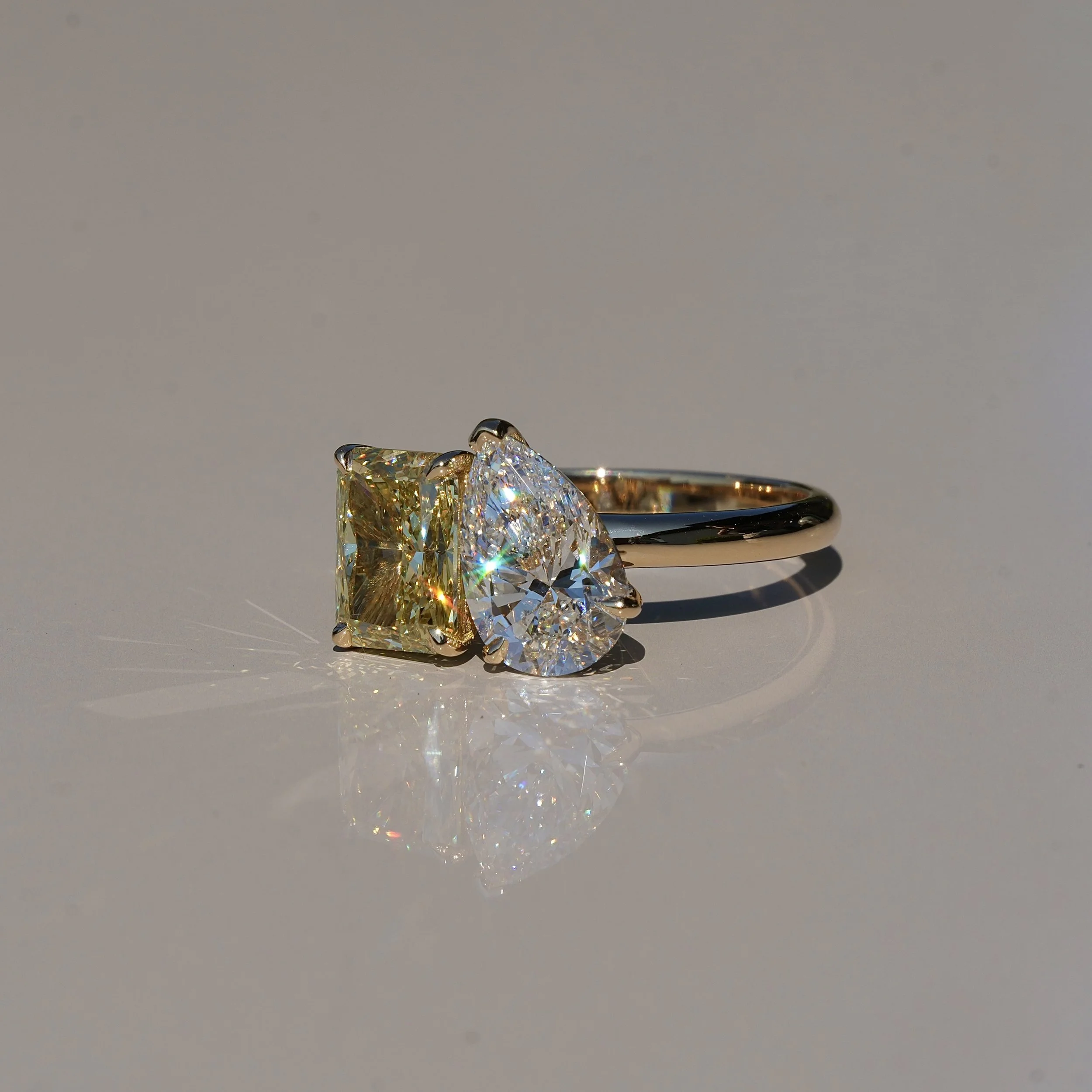 Toi et Moi Ring with 1.5ct Fancy Intense Yellow Radiant Cut Diamond and 1.5ct Pear Cut Diamond in 18ct Yellow Gold, Total Carat Weight 3ct – Side View | Eighty8Diamonds