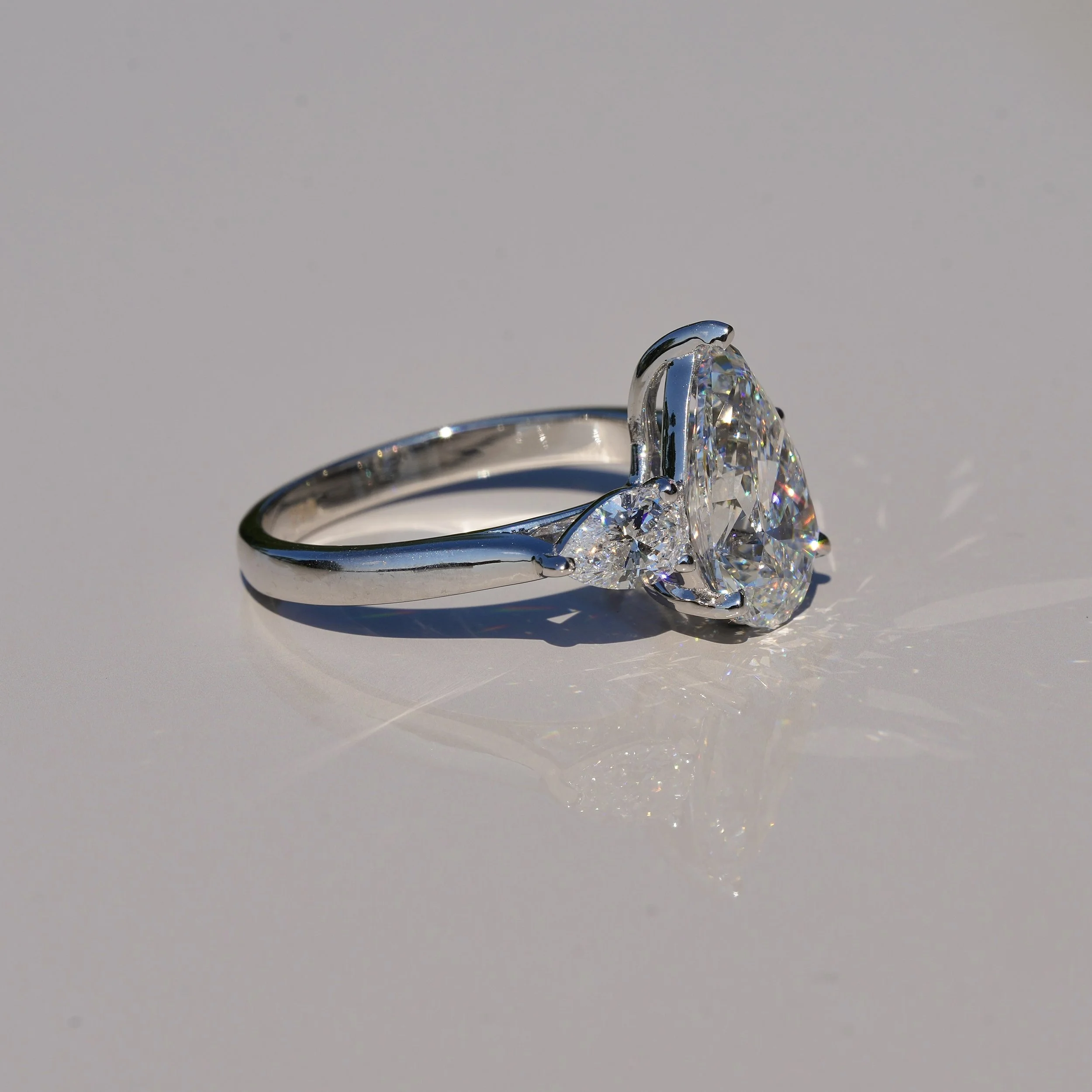 3ct Pear Cut Diamond Trilogy Engagement Ring with Two 0.4ct Side Stones in 18ct White Gold, Total 3.8ct – Back View | Eighty8Diamonds