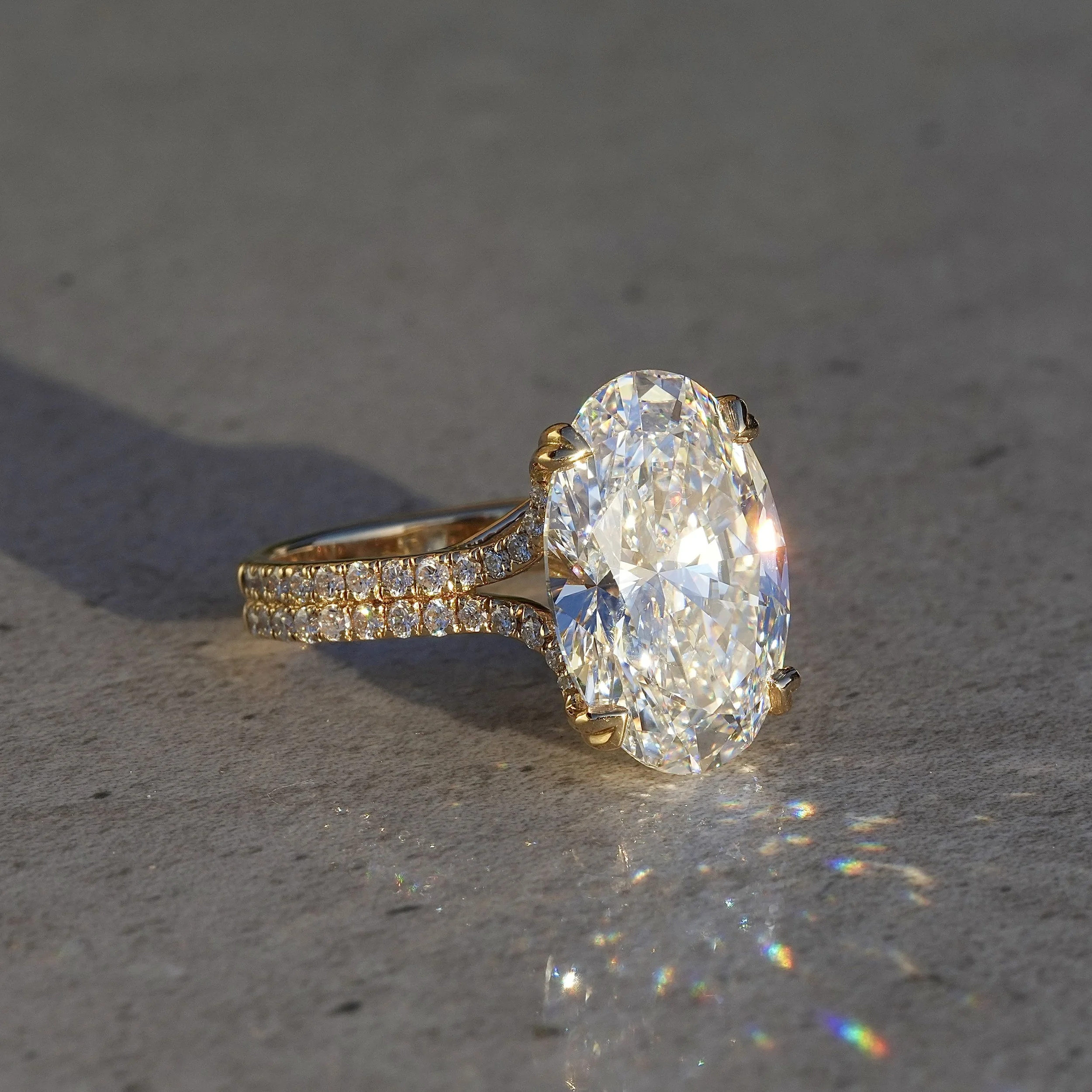 8ct Oval Cut Diamond Engagement Ring with Diamond Band in 18ct Yellow Gold – Side View | Eighty8Diamonds