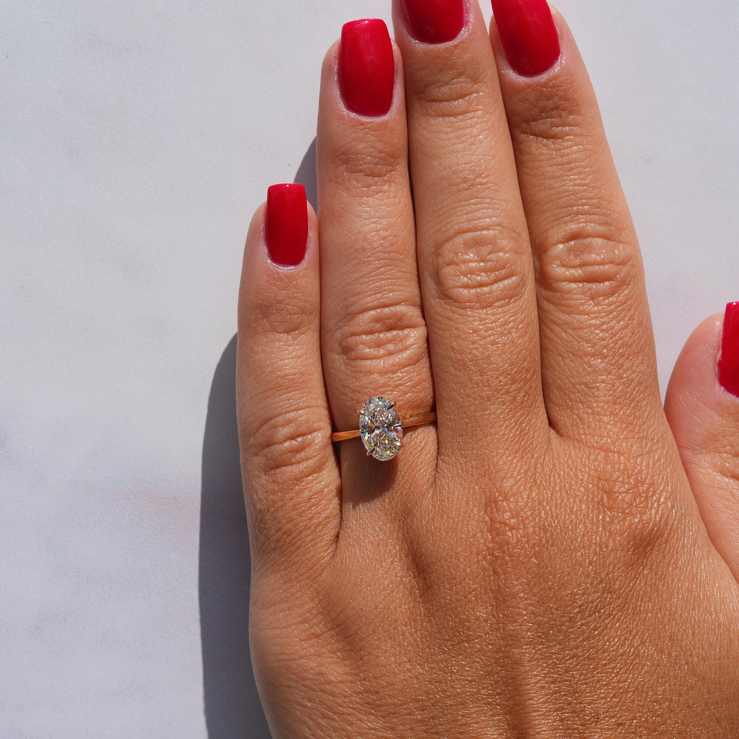 2ct Oval Cut Diamond Engagement Ring With Hidden Halo in 18ct Yellow Gold - Hand View |