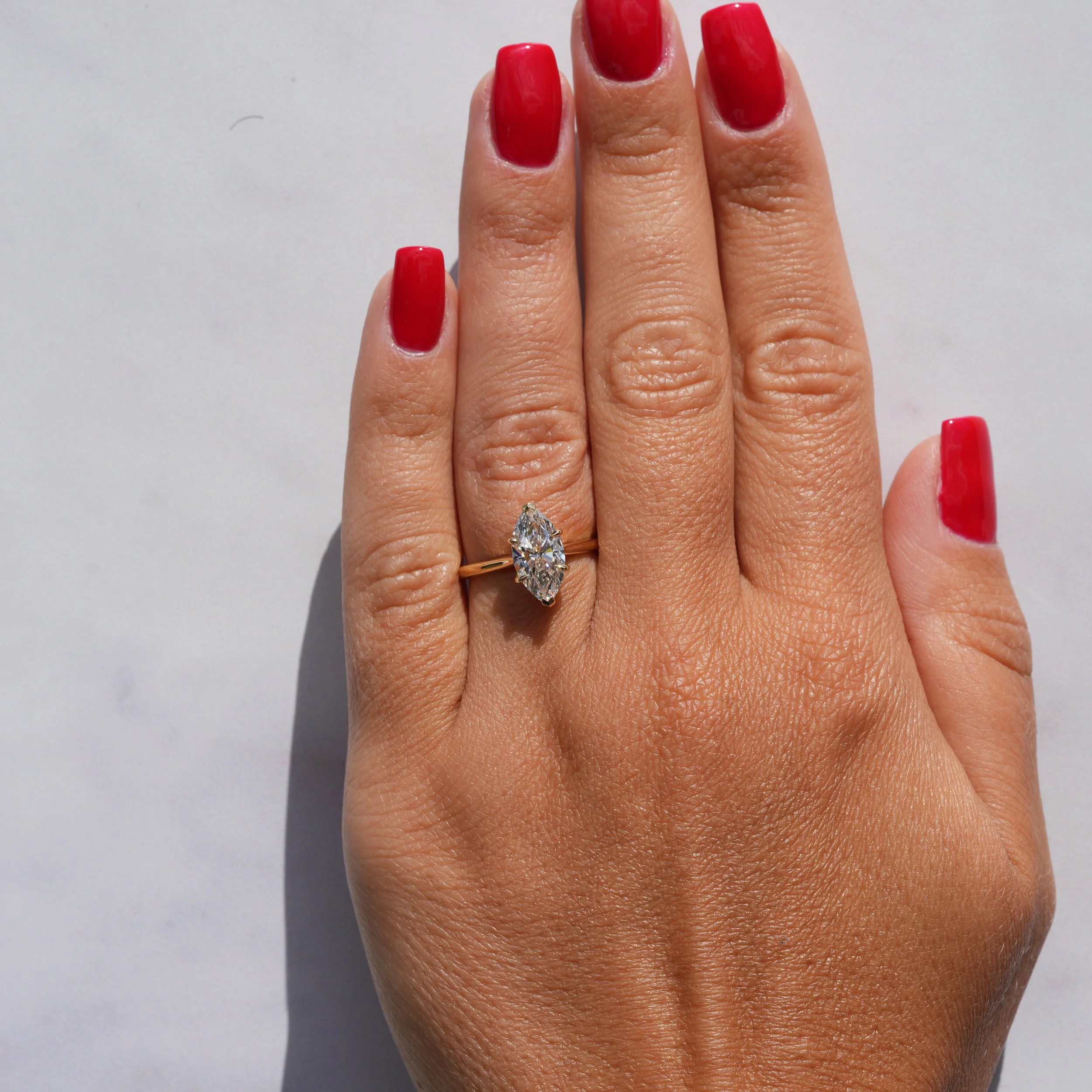 marquise-diamond-2carat-solitaire-18ct-yellow-gold-eighty8diamonds-hand-view