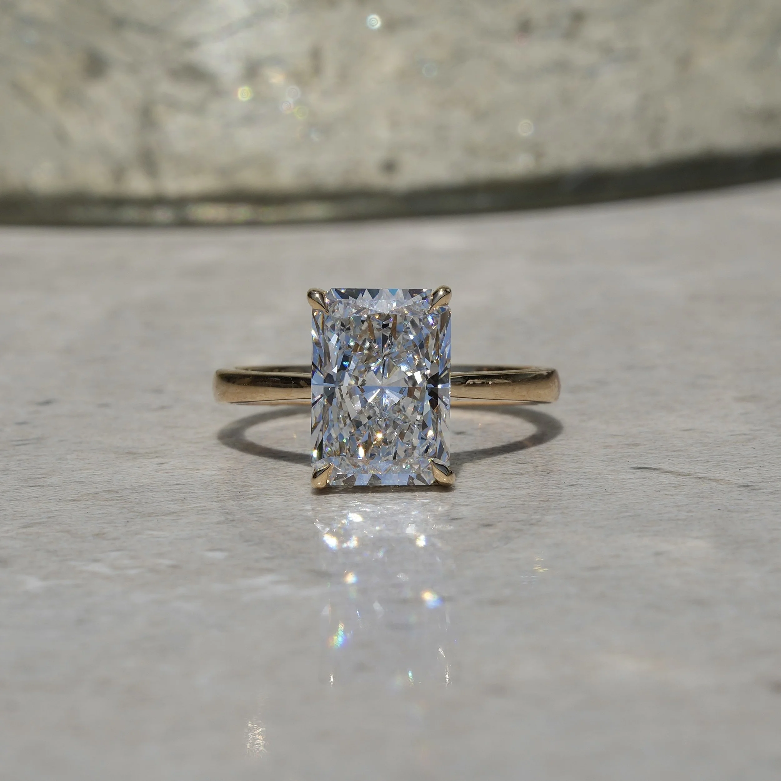 3ct Radiant Cut Diamond Solitaire Engagement Ring with Hidden Halo  in 18ct Yellow Gold – Hand View | Eighty8Diamonds