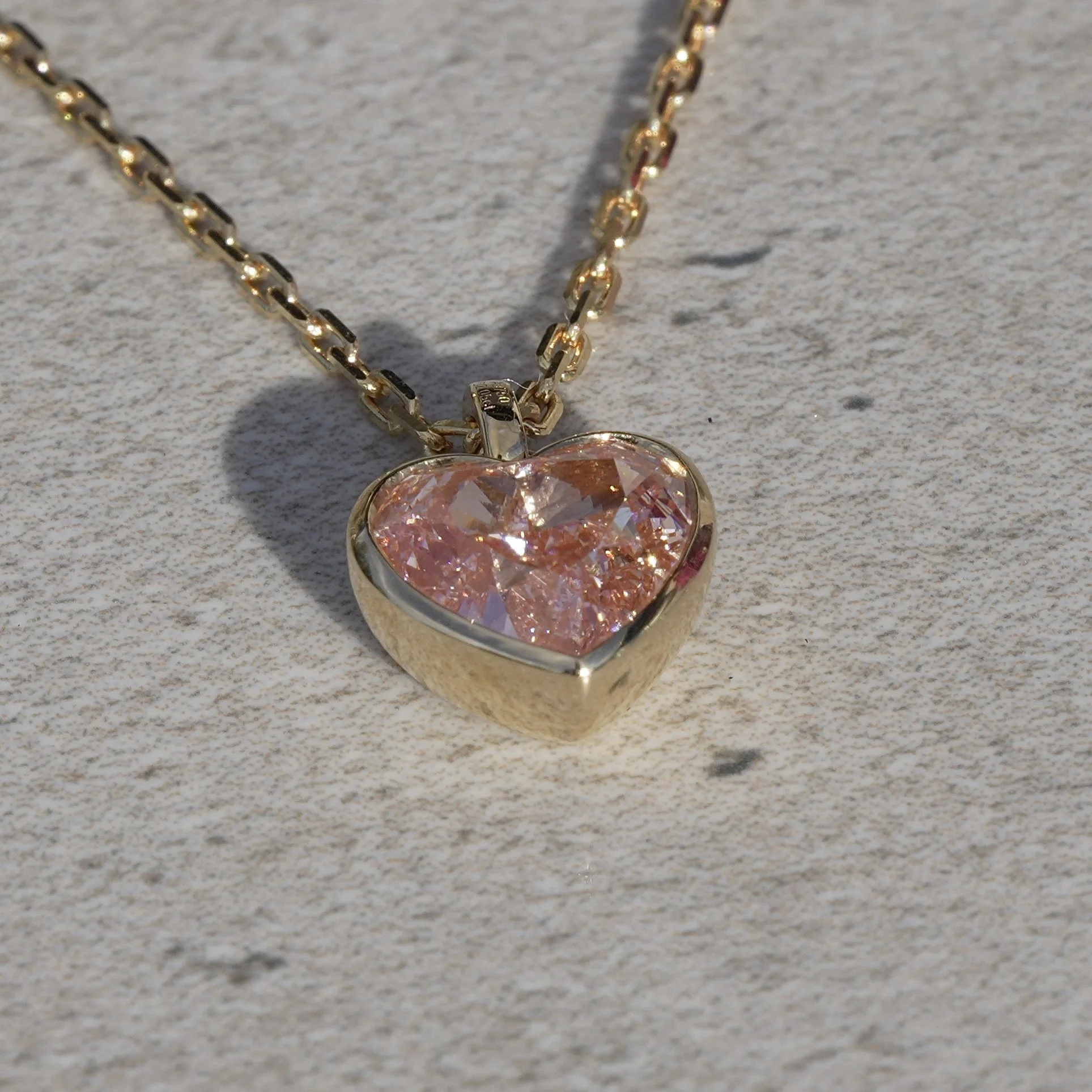 2ct Fancy Vivid Pink Heart Diamond Pendant in 18K Yellow Gold, IGI Certified – Angeled View | Eighty8Diamonds