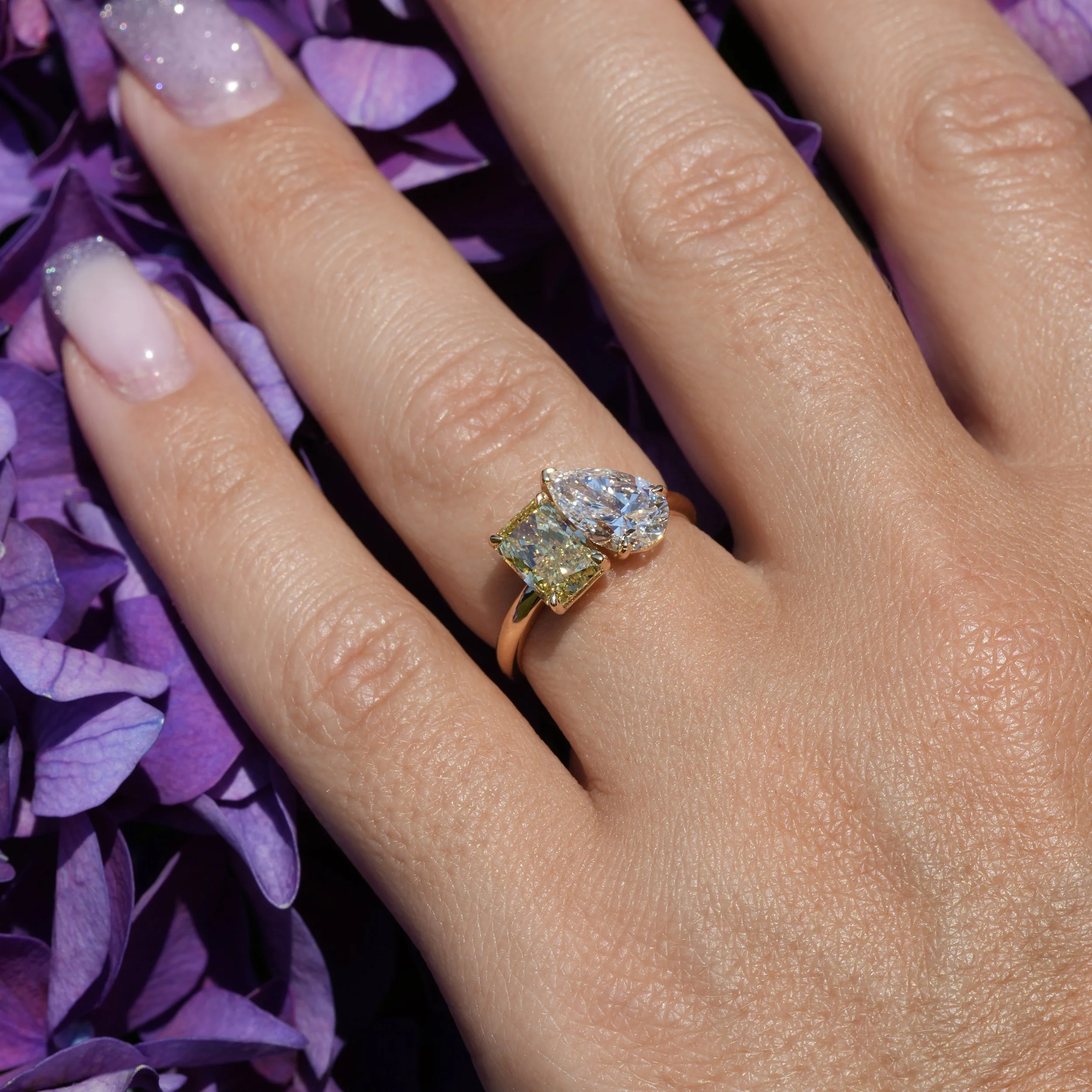 Toi et Moi Ring with 1.5ct Fancy Intense Yellow Radiant Cut Diamond and 1.5ct Pear Cut Diamond in 18ct Yellow Gold, Total Carat Weight 3ct – Hand View | Eighty8Diamonds