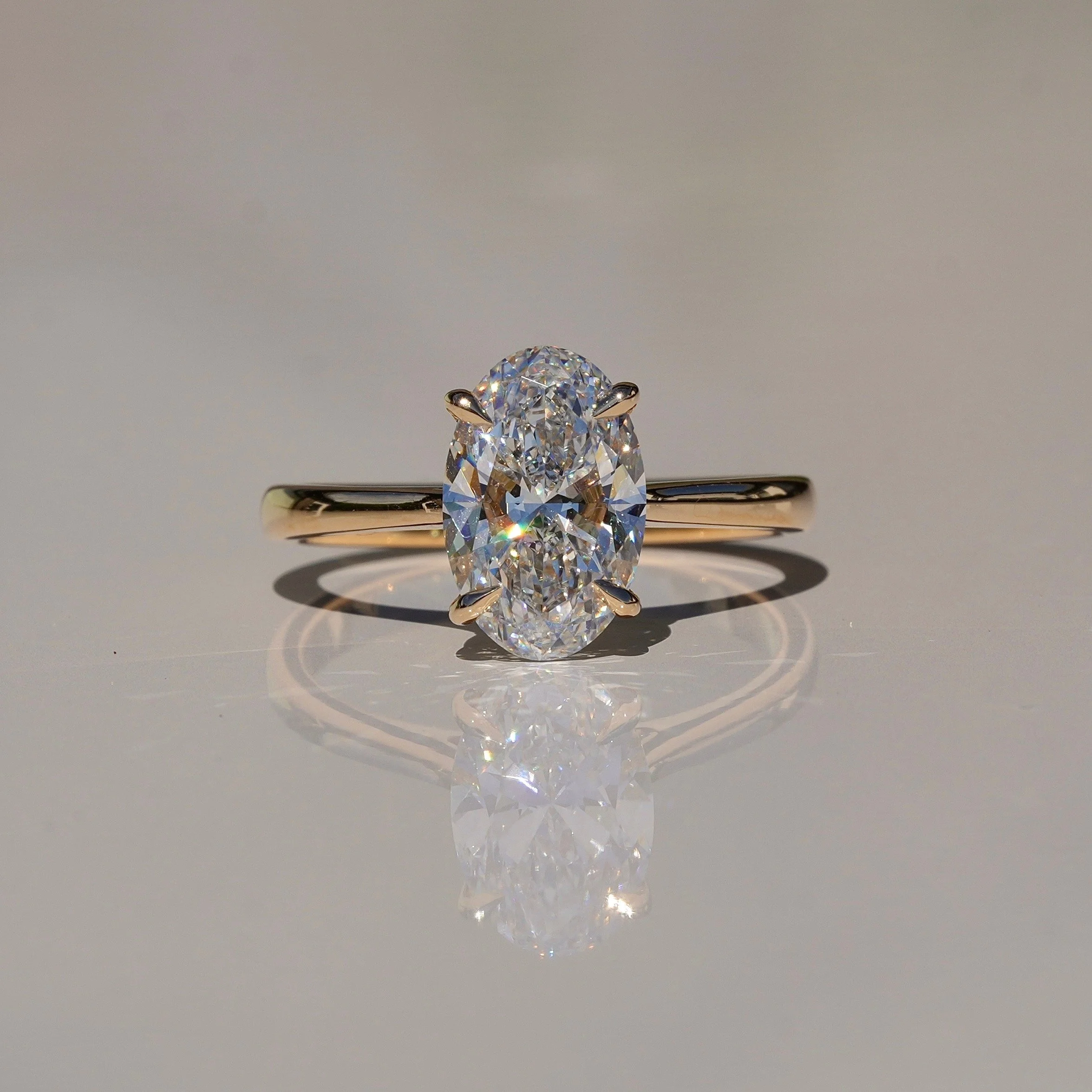 2ct Oval Cut Diamond Engagement Ring With Hidden Halo in 18ct Yellow Gold - Front View |