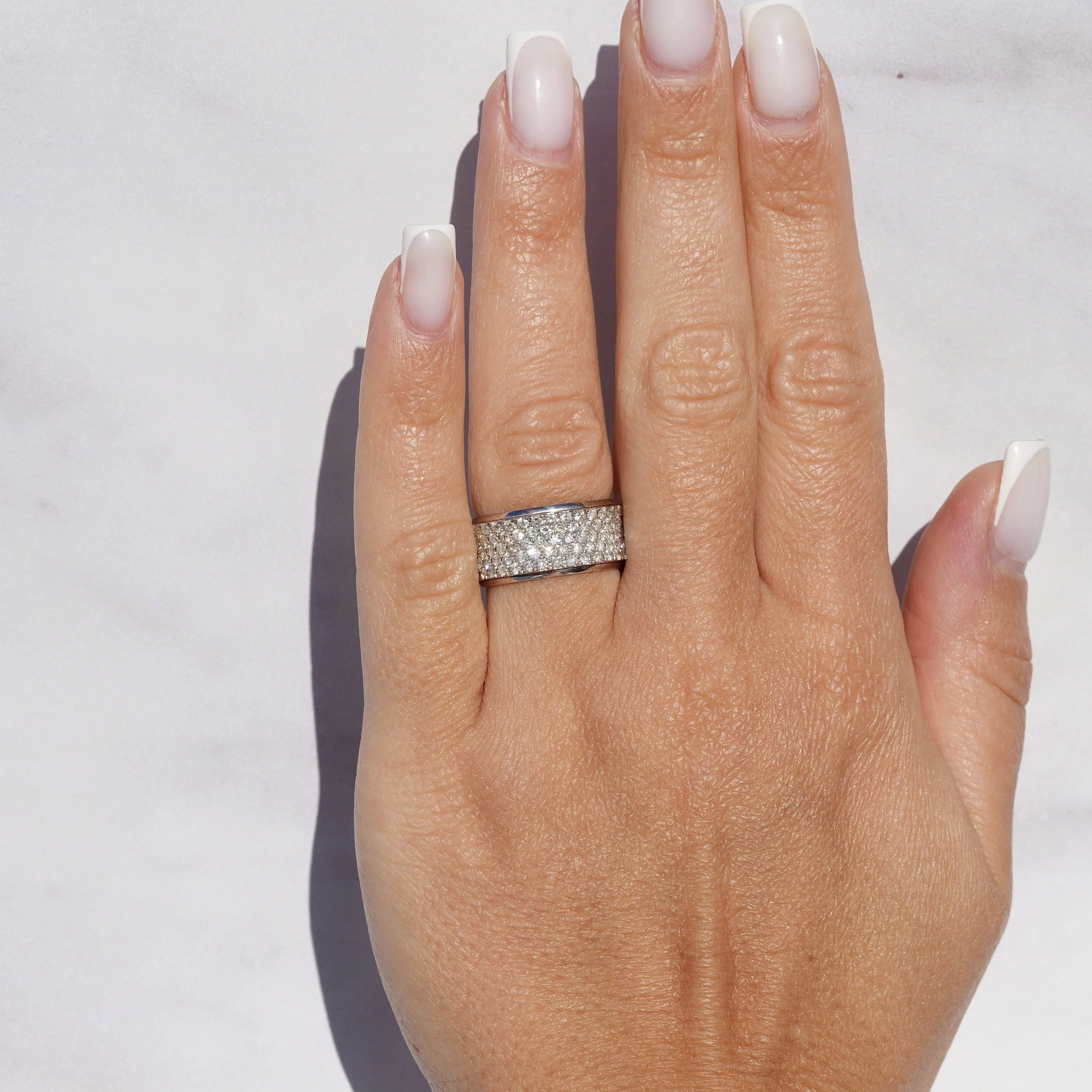 White Gold Half Diamond Pavé Band in 18ct White Gold with 1.20ct  Diamonds –Hand View | Eighty8Diamonds