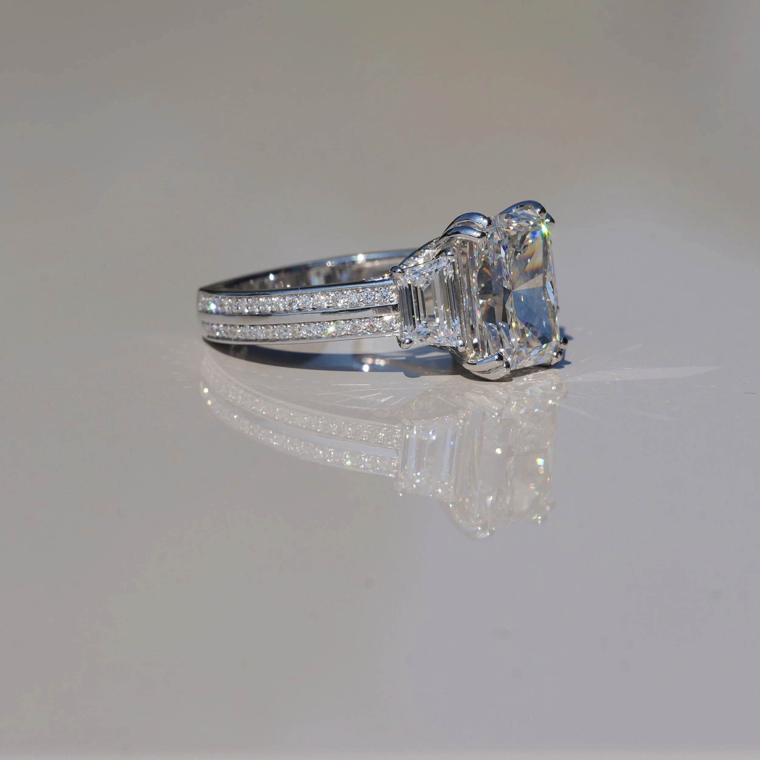 4ct Radiant Cut Diamond Engagement Ring with 3D Diamond Band and Trapezoid Side Stones in 18ct White Gold – Side Angle | Eighty8Diamonds