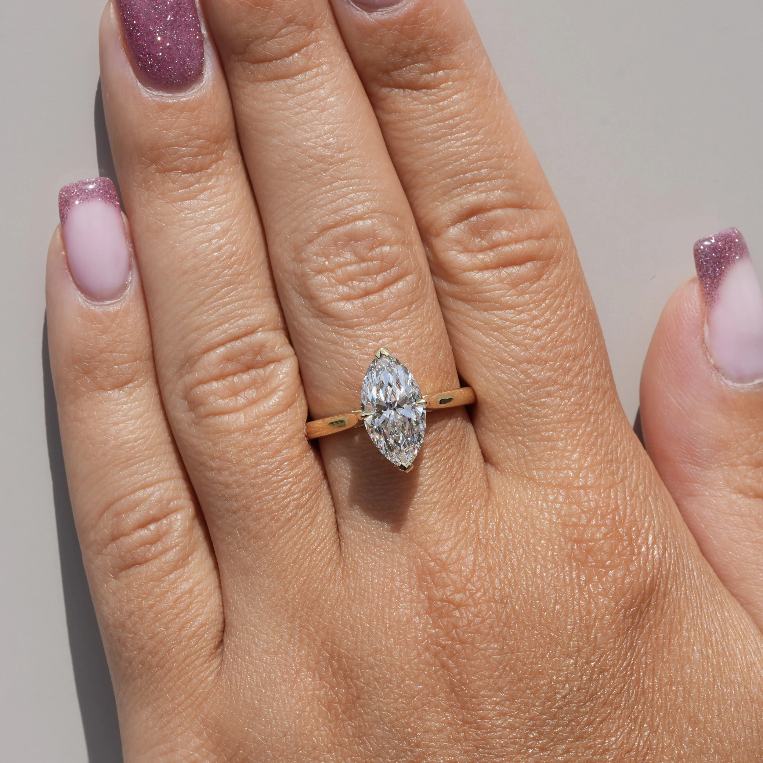 3ct Marquise Cut Diamond Solitaire Engagement Ring with Hidden Halo  in 18ct Yellow Gold – Hand View | Eighty8Diamonds