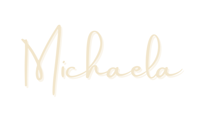 The name 'Michaela' written in a cursive, handwritten style font on a black background.