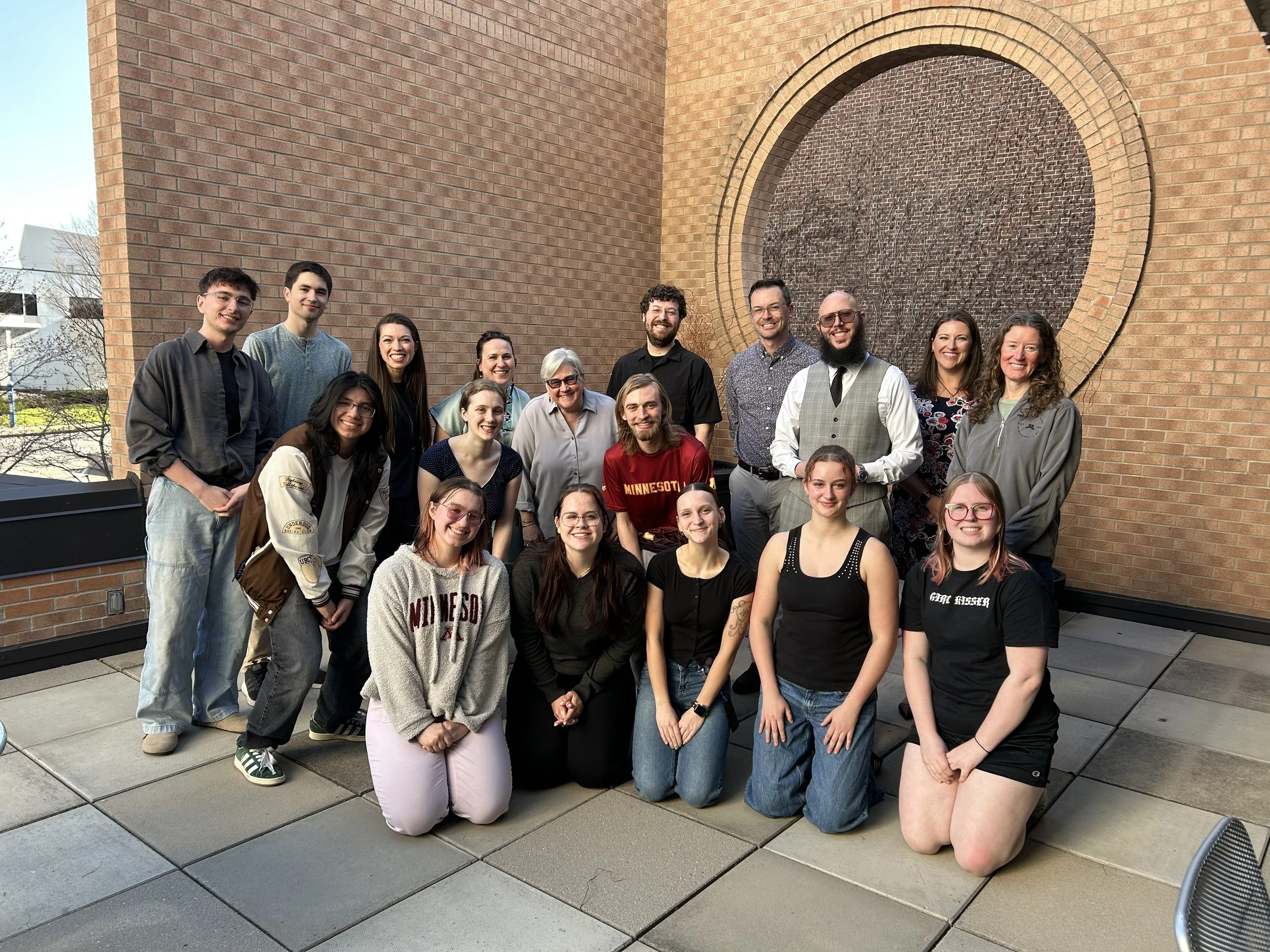 Teachers from the Changemakers in Music Education post for a photo with university students