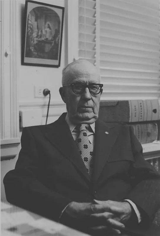 90 Dr. JL Kee sitting at office desk.jpg