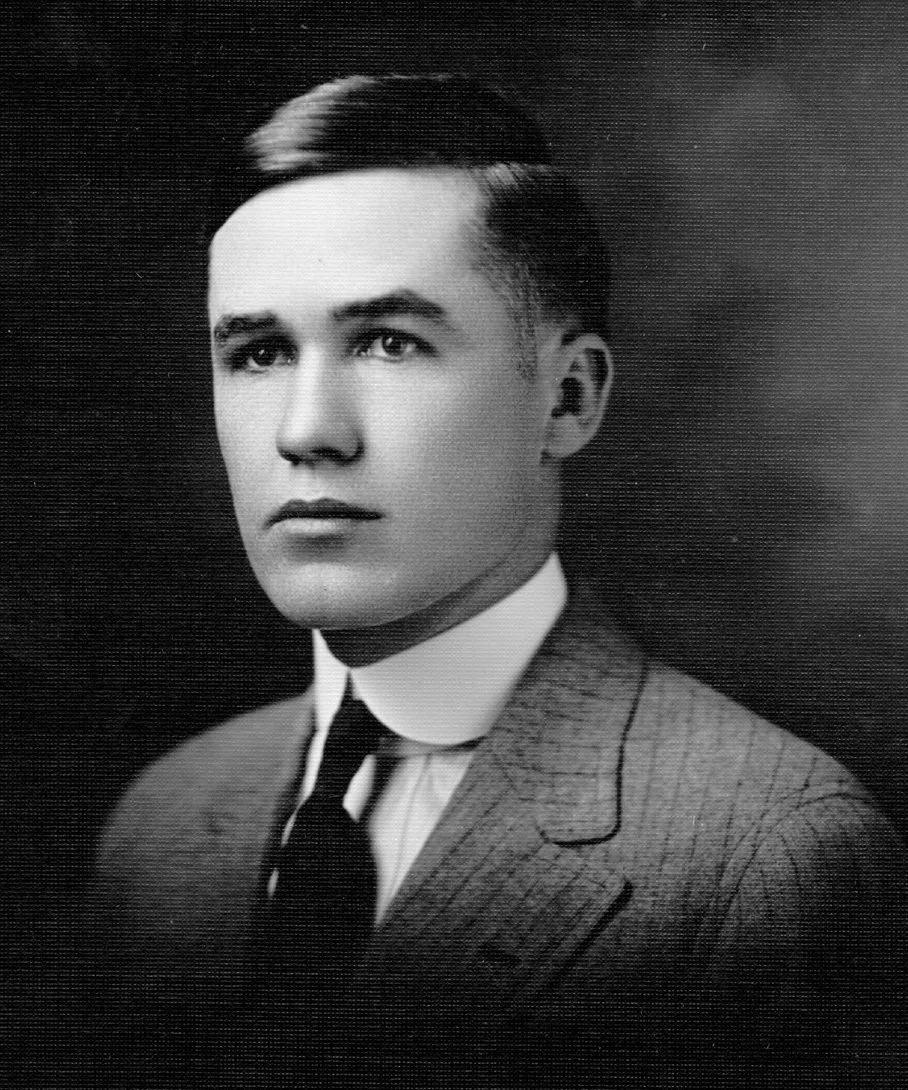 87 Dr. JL Kee - striped-suit portrait.jpg