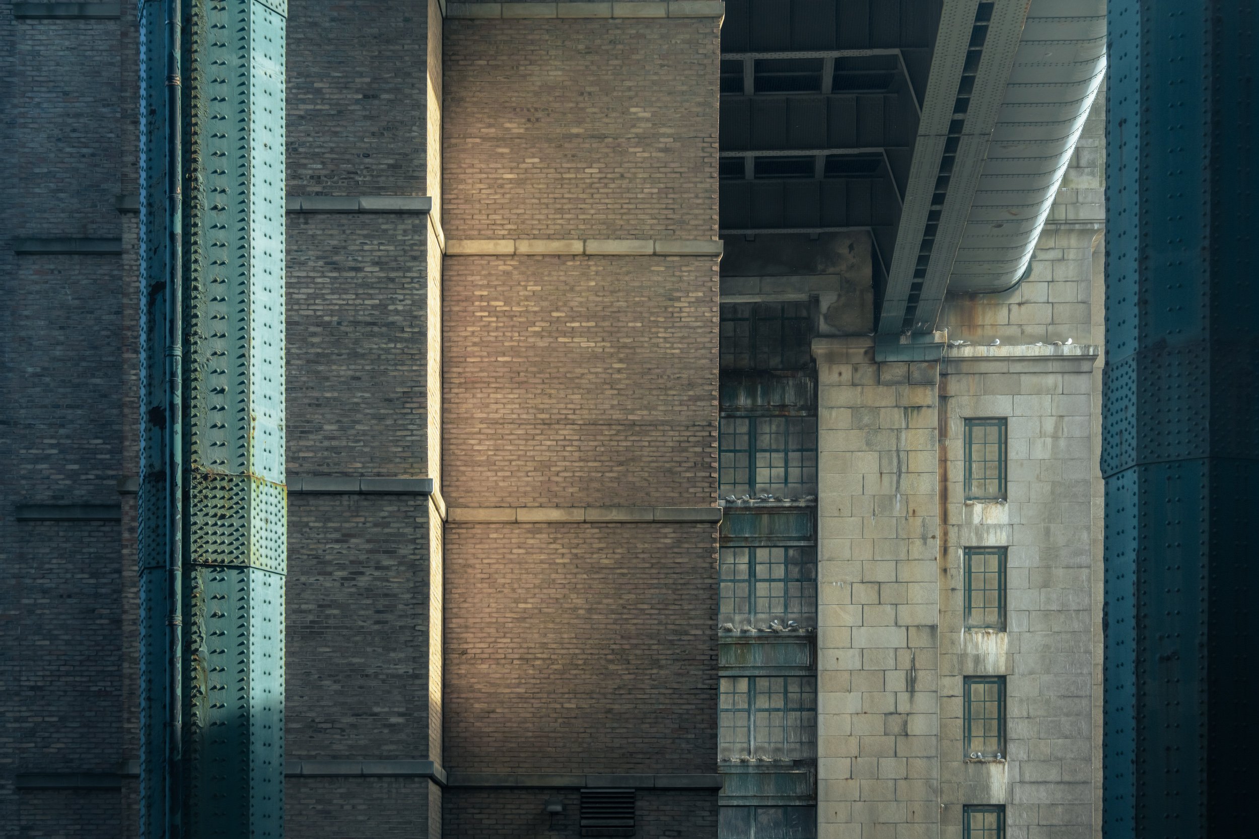 green-metal-red-brick-building.jpg