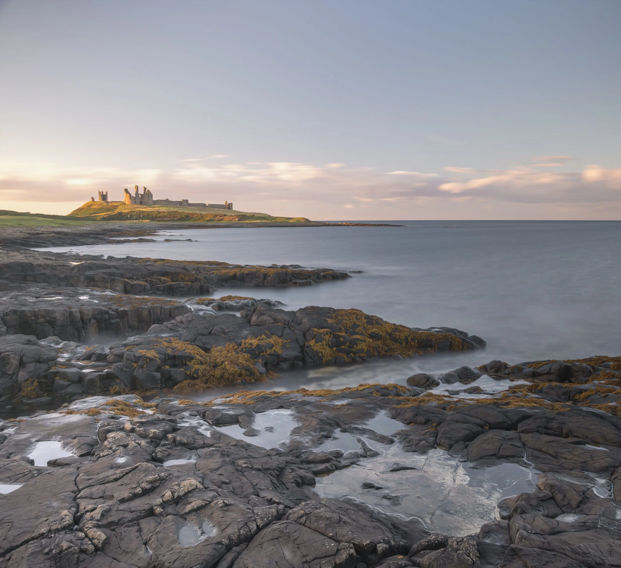 castle-rocks-pools-sunset-sea.jpg