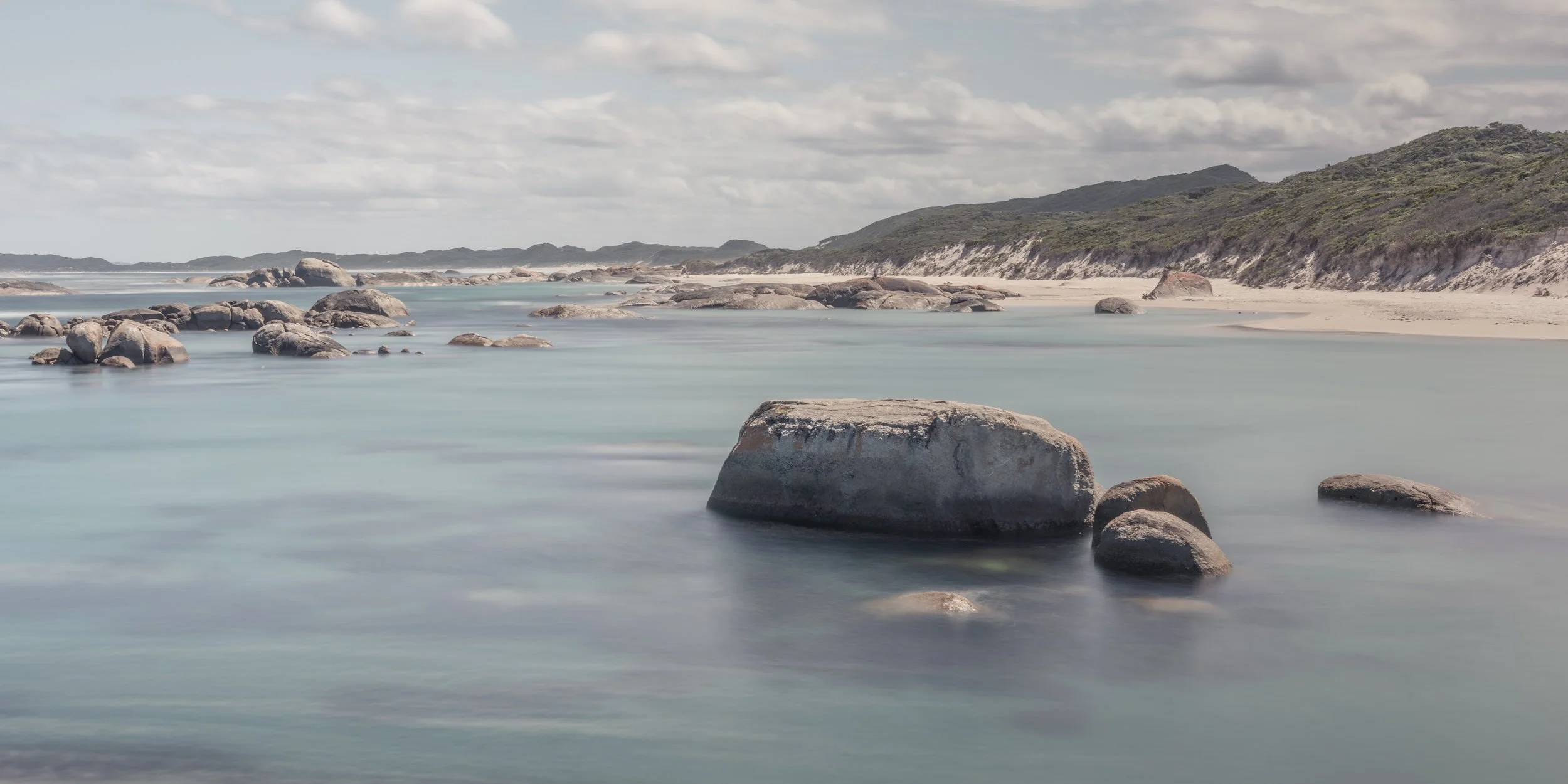 sandy-bay-ocean-rocks.jpg