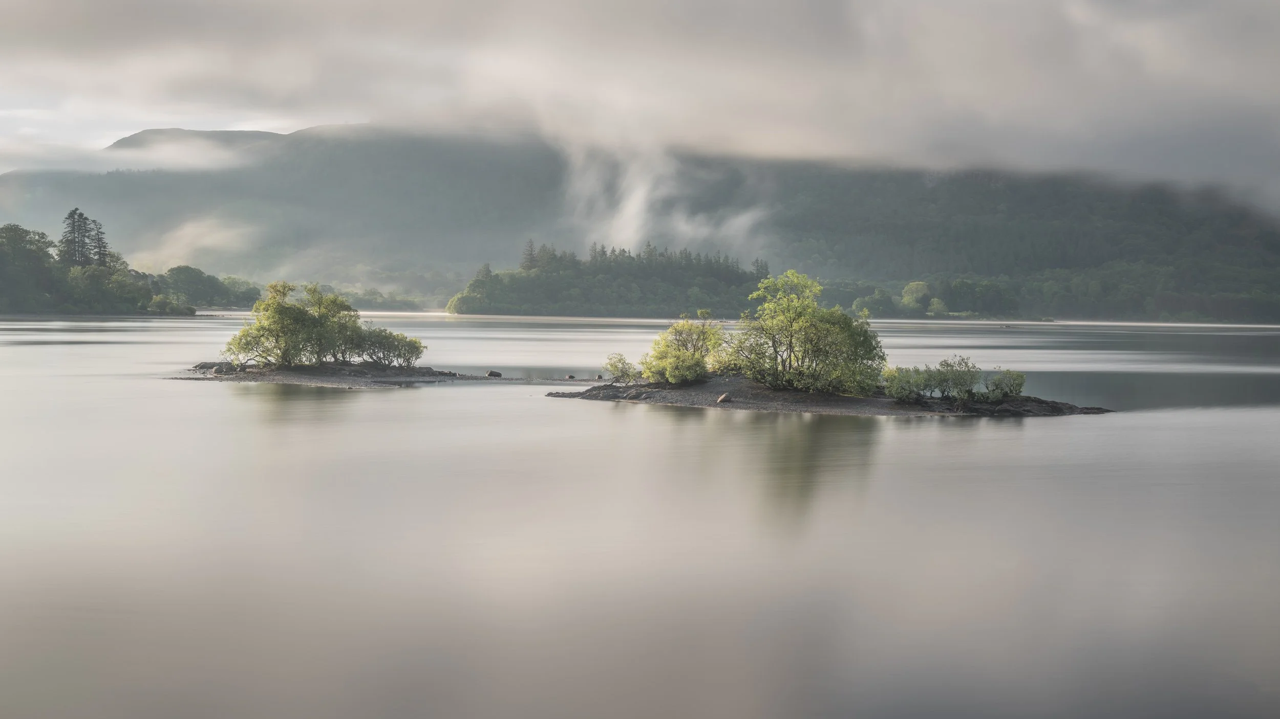 steam-rising-trees-island-lake.jpg