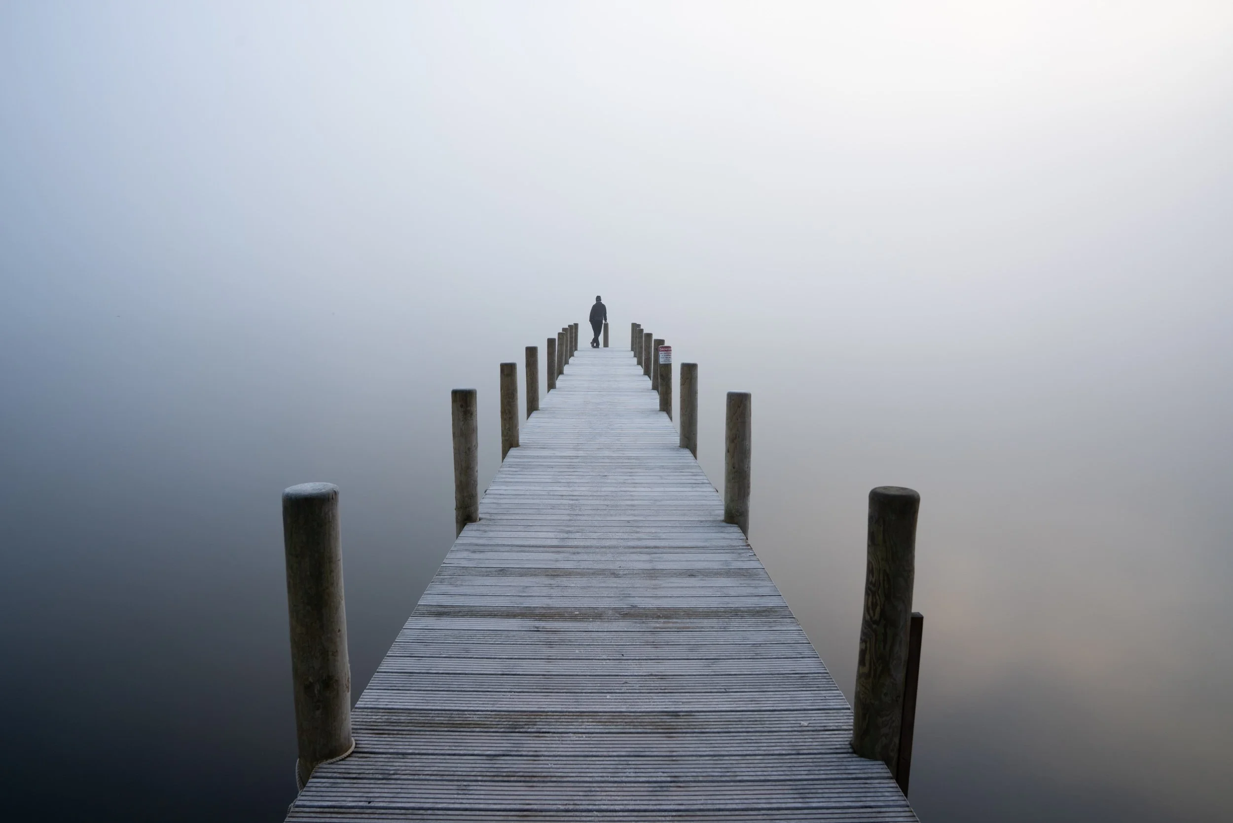 man-alone-jetty-lakeside.jpg
