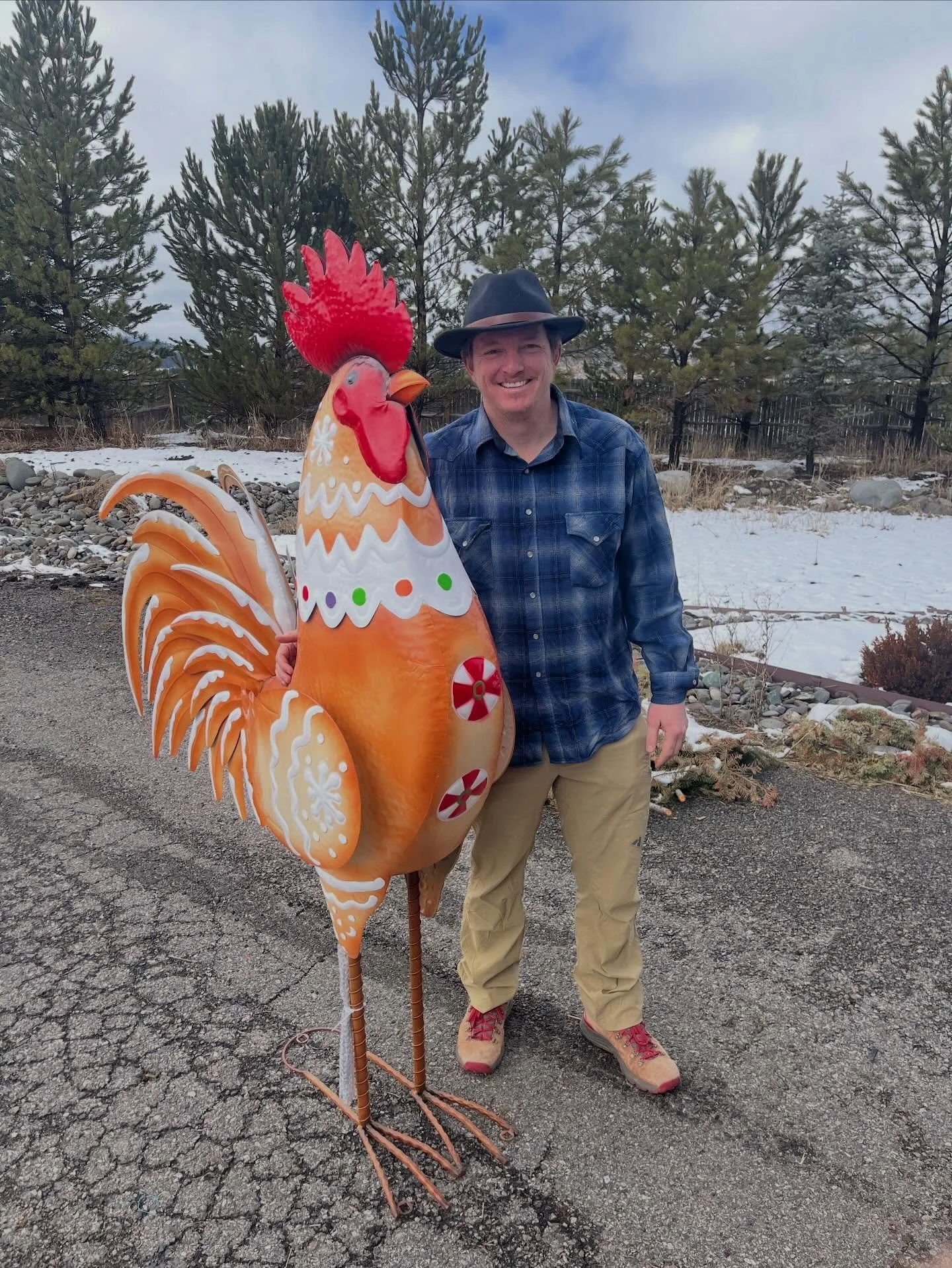 Meet our newest ranch guardian: Kringle. Standing at approximately &ldquo;why is this taller than a grown man?&rdquo; feet, he now oversees Cerulean Skies Ranch with unwavering metal confidence.
Kevin posed bravely for this photo, though negotiations