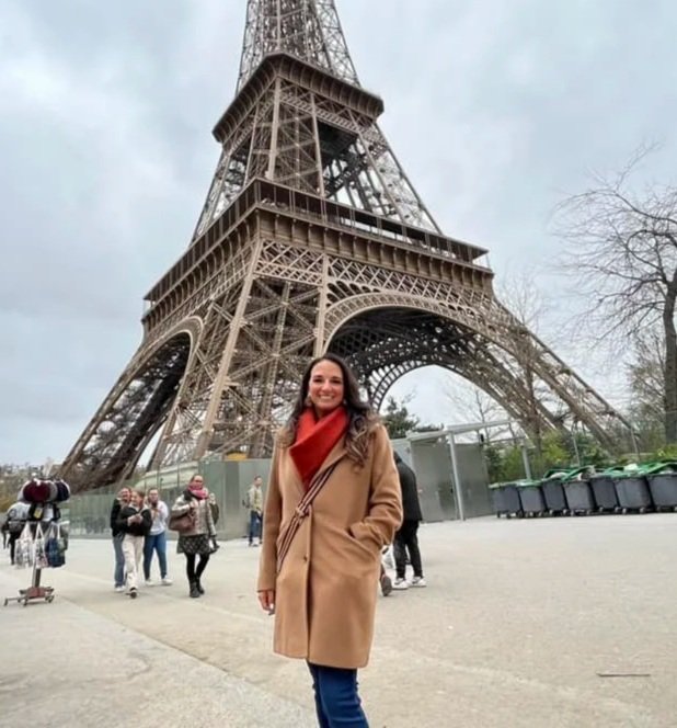 Journeys Travel owner Dawn Trenary in front of the Eiffel Tower in Paris, France.