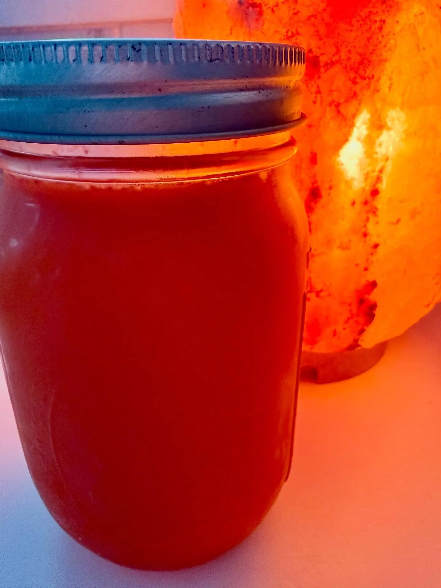 sensual Sacral glow up nectar beside the #himalayansaltlamp 💡🧡🍊#sacralchakra #chakwavejuicecleanse #orangejuice