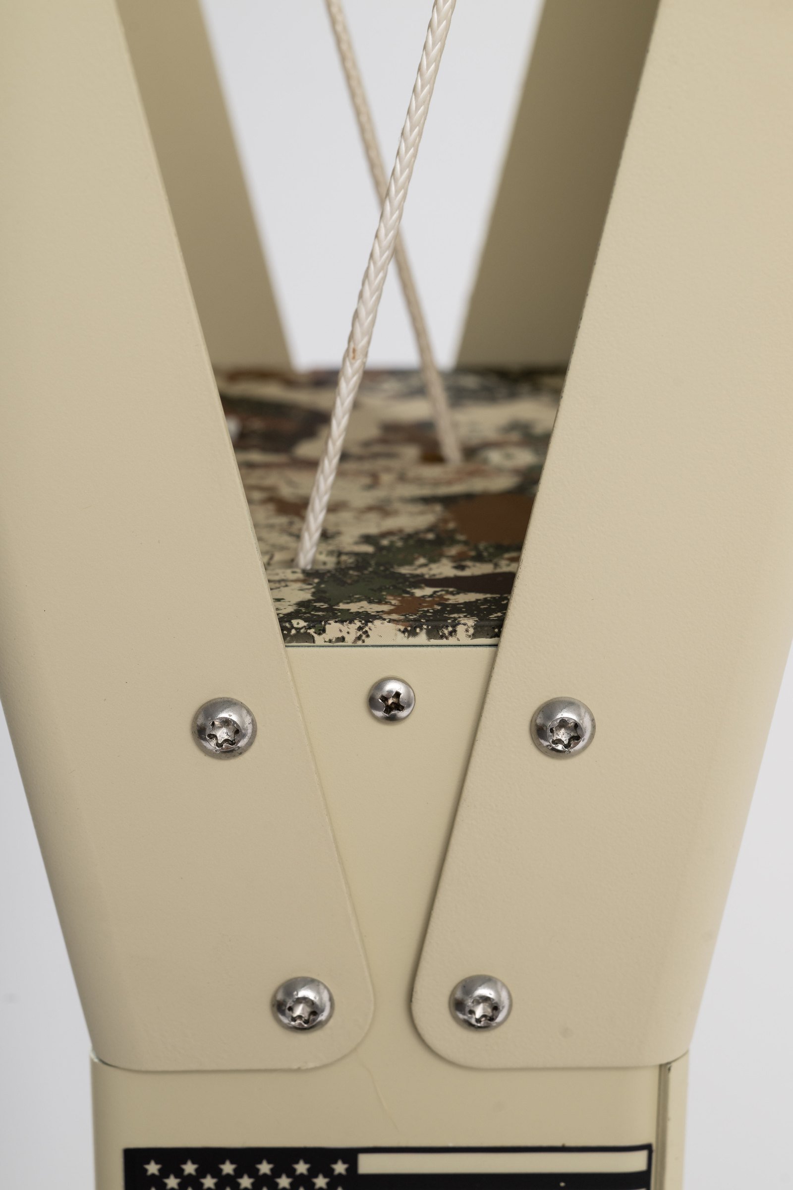 Cables and fasteners inside the upper frame