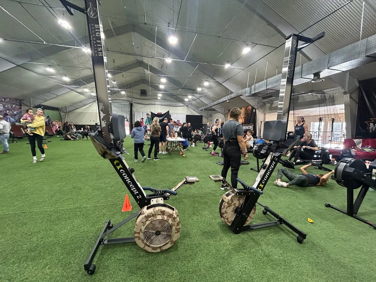 Rowing machines and participants on the DT’s Row 2025 event floor.