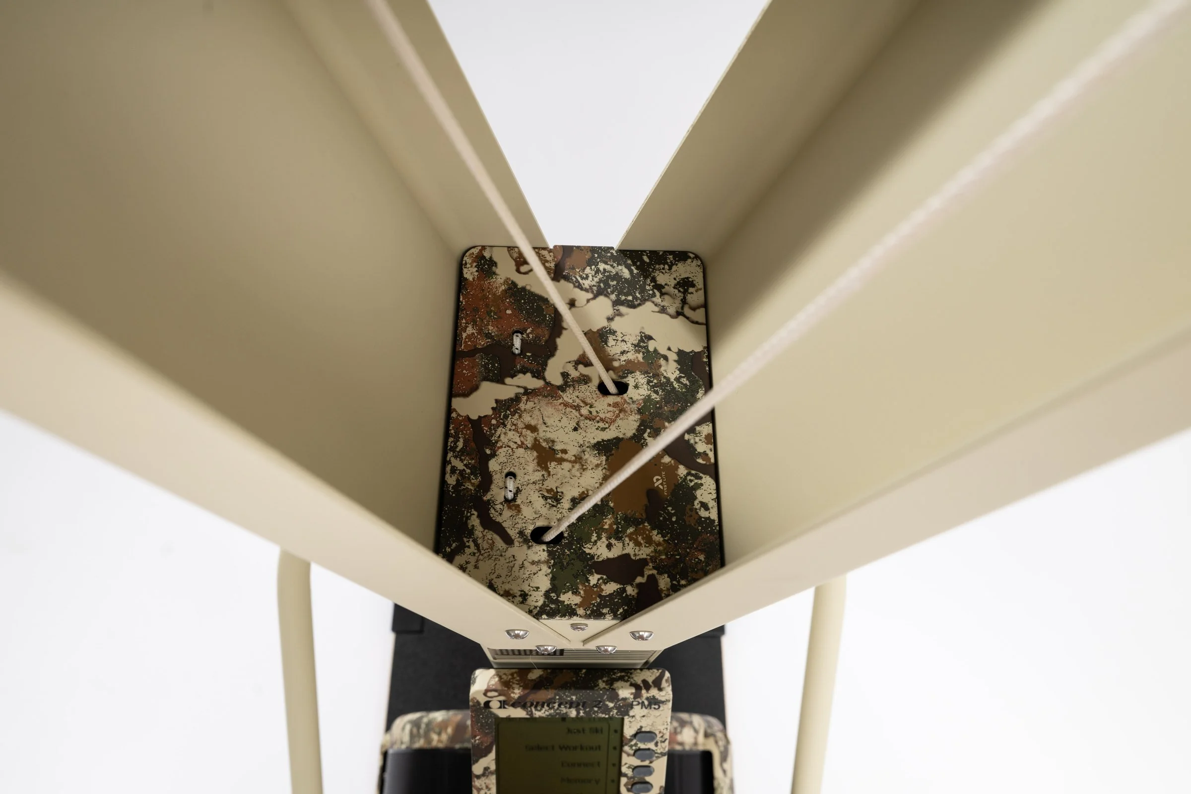 View inside the SkiErg frame toward the camouflage housing